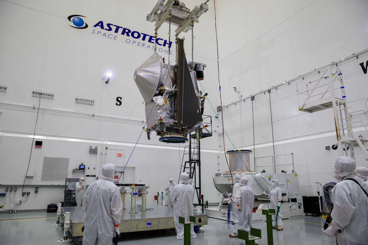 NASA’s Lucy spacecraft, with its high gain antenna attached, is lifted by crane from a rotation stand inside the Astrotech Space Operations Facility in Titusville, Florida on Sept. 8, 2021. Lucy is scheduled to launch no earlier than Saturday, Oct. 16, on a United Launch Alliance Atlas V 401 rocket from Launch Pad 41 at Cape Canaveral Space Force Station. NASA’s Launch Services Program based at Kennedy Space Center is managing the launch. Over its 12-year primary mission, Lucy will explore a record-breaking number of asteroids, flying by one asteroid in the solar system’s main belt and seven Trojan asteroids. Additionally, Lucy’s path will circle back to Earth three times for gravity assists, making it the first spacecraft ever to return to the vicinity of Earth from the outer solar system. 