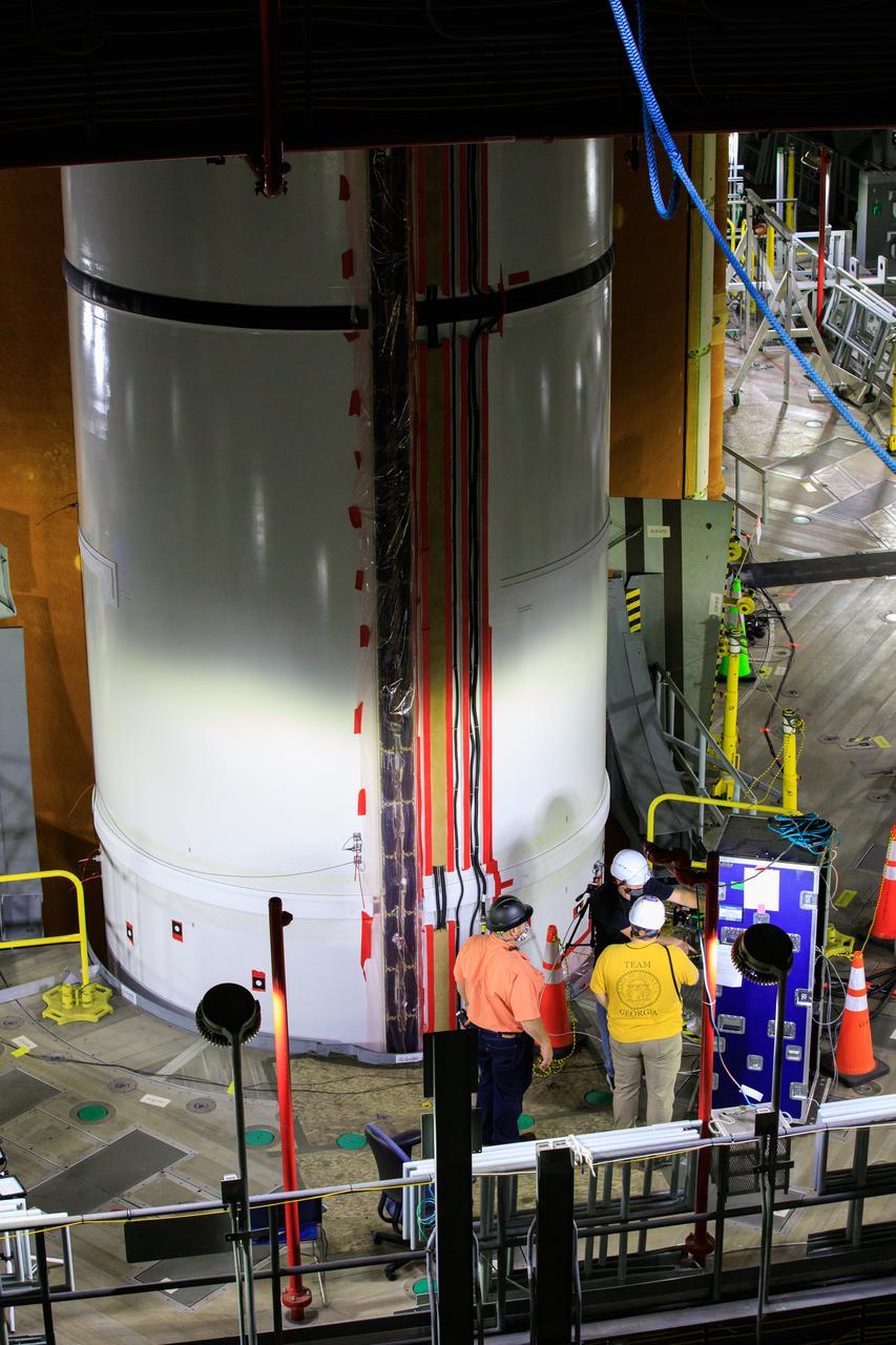 Artemis teams members perform the integrated modal test of the Space Launch System and mobile launcher in High Bay 3 of the Vehicle Assembly Building at NASA’s Kennedy Space Center in Florida on Sept. 24, 2021. The tests will help determine the natural frequencies of the recently stacked rocket before launch of the Artemis I mission. The data also will be used to help steer the rocket during flight. To identify the rocket’s natural frequencies, the team placed about 300 sensors on it and the mobile launcher to detect, record, and transmit the information, along with hydraulic shakers attached to seven locations on the rocket. Artemis I will be the first integrated test of the SLS and Orion spacecraft. In later missions, NASA will land the first woman and the first person of color on the surface of the Moon, paving the way for a long-term lunar presence and serving as a steppingstone on the way to Mars. 
