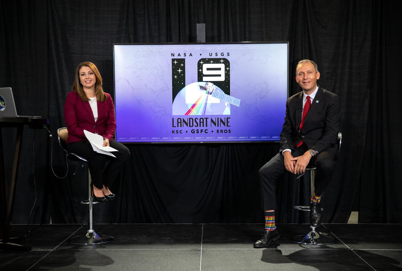 From left, Marie Lewis, NASA Communications; and Thomas Zurbuchen, associate administrator, NASA’s Science Mission Directorate, speak to members of the news media during a prelaunch news conference for NASA’s Landsat 9 mission at Vandenberg Space Force Station in California on Sept. 25, 2021. Landsat 9 is scheduled to launch at 2:12 p.m. EDT (11:12 a.m. PDT) on Monday, Sept. 27, on a United Launch Alliance Atlas V 401 rocket from Space Launch Complex 3 at Vandenberg. The launch is managed by NASA’s Launch Services Program, based at the agency’s Kennedy Space Center in Florida. Landsat 9 will join its sister satellite, Landsat 8, in orbit in collecting images from across the planet every eight days. This calibrated data will continue the Landsat program’s critical role in monitoring the health of Earth and helping people manage essential resources, including crops, irrigation water, and forests.
