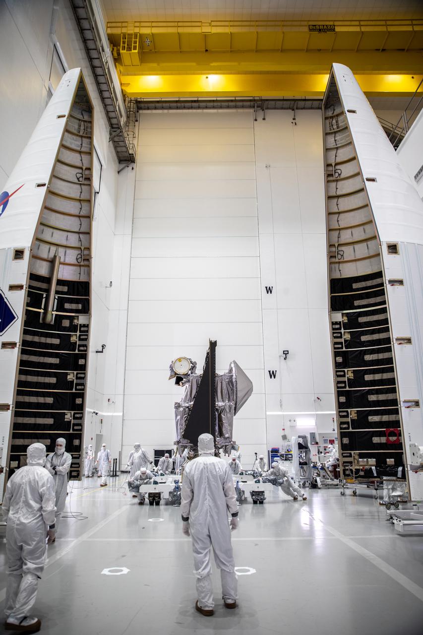 NASA’s Lucy spacecraft is moved from the Work Processing Cell to the Airlock inside the Astrotech Space Operations Facility in Titusville, Florida, on Sept. 29, 2021. A United Launch Alliance V 401 rocket roared off the pad at Cape Canaveral Space Force Station’s Space Launch Complex 41 on Oct. 16, 2021, at 5:34 a.m. EDT, carrying Lucy into space. During its 12-year primary mission, Lucy will explore a record-breaking number of asteroids, flying by one asteroid in the solar system’s main belt and seven Trojan asteroids. Lucy is the first space mission to study the Trojan asteroids, which hold vital clues to the formation of our solar system.