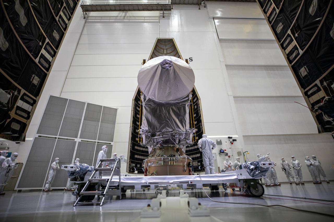Inside the Astrotech Space Operations Facility in Titusville, Florida, the first half of the United Launch Alliance (ULA) payload fairing is moved toward NASA’s Lucy spacecraft on Sept. 30, 2021. The payload fairing will encapsulate and protect the spacecraft during launch and ascent. Lucy is scheduled to launch no earlier than Saturday, Oct. 16, on a ULA Atlas V 401 rocket from Space Launch Complex 41 at Cape Canaveral Space Force Station. NASA’s Launch Services Program based at Kennedy Space Center is managing the launch. Over its 12-year primary mission, Lucy will explore a record-breaking number of asteroids, flying by one asteroid in the solar system’s main belt and seven Trojan asteroids. Additionally, Lucy’s path will circle back to Earth three times for gravity assists, making it the first spacecraft ever to return to the vicinity of Earth from the outer solar system. 