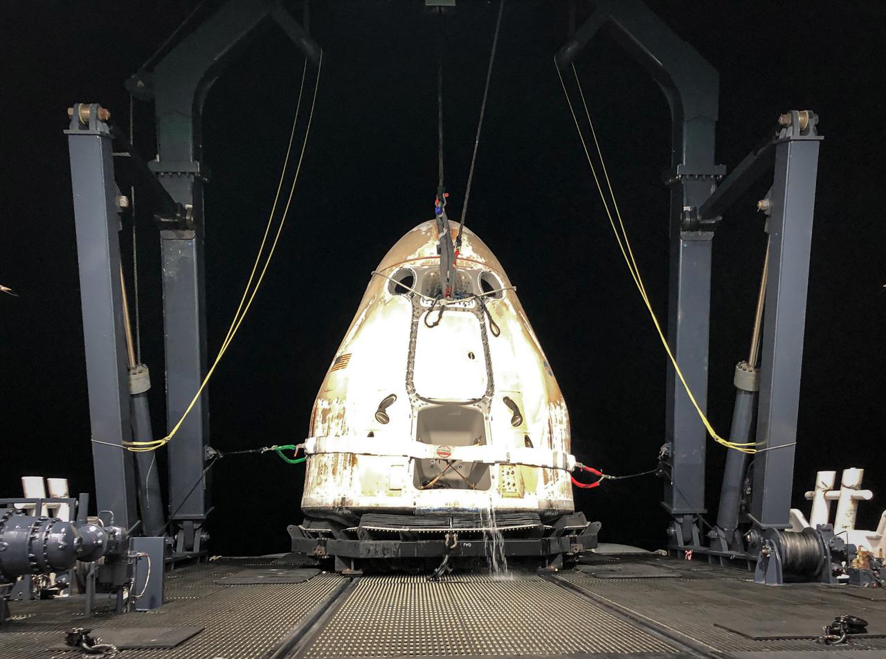 SpaceX’s Cargo Dragon spacecraft is lifted aboard a recovery vessel after splashing down in the Atlantic Ocean off the coast of Florida on Thursday, Sept. 30, 2021. The capsule, carrying cargo that flew aboard NASA’s SpaceX 23rd commercial resupply services mission, undocked from the International Space Station Thursday at approximately 9 a.m. The event marked the first time a Cargo Dragon splashed down in the Atlantic Ocean. Cargo from the capsule was delivered to the Launch and Landing Facility at Kennedy Space Center.