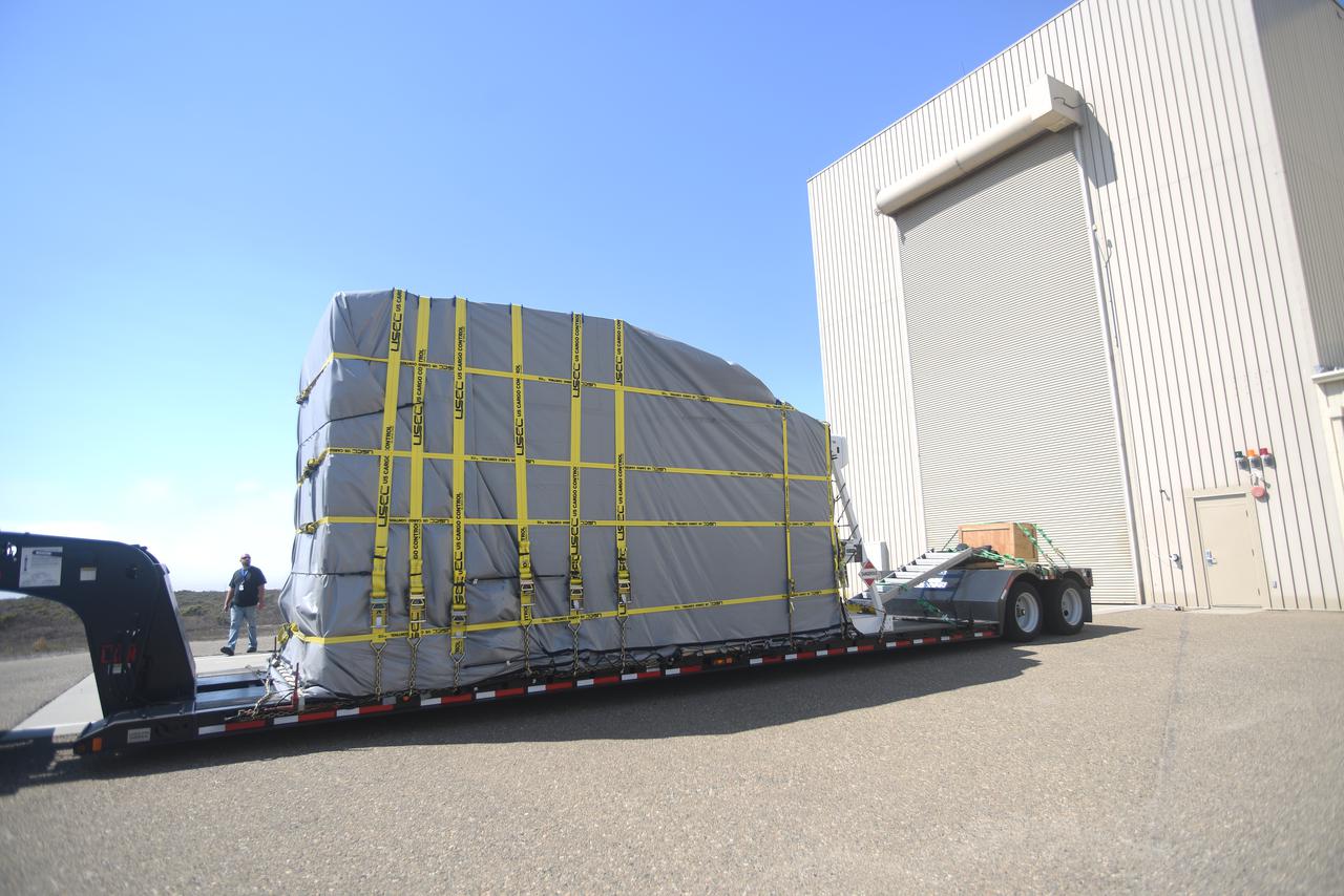 NASA’s Double Asteroid Redirection Test (DART) spacecraft, packed in its shipping container, arrives by truck at the entrance to the Astrotech Space Operations Facility at Vandenberg Space Force Base in California on Oct. 2, 2021. Inside the facility, workers will unpack the spacecraft and complete a series of final tests and checkouts to confirm it is ready for launch. DART is the first mission to test technologies for preventing an impact of Earth by a hazardous asteroid. The mission is targeted to launch on Nov. 23, 2021, aboard a SpaceX Falcon 9 rocket from Vandenberg. NASA’s Launch Services Program, based at Kennedy Space Center, America’s multi-user spaceport, is managing the launch.