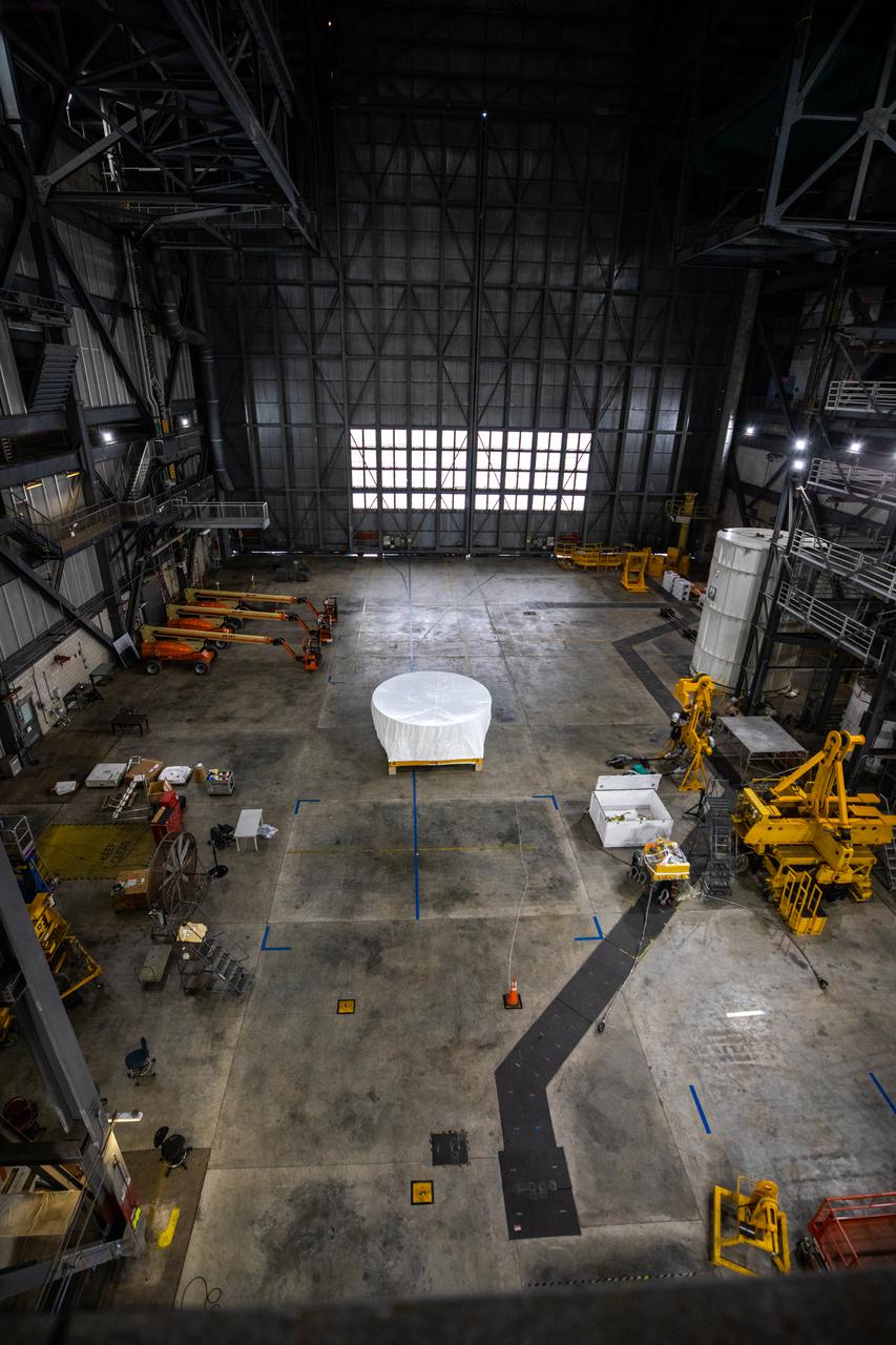 Under a protective cover, the Orion Stage Adapter (OSA) arrives in High Bay 4 of the Vehicle Assembly Building on Oct. 4, 2021, at NASA's Kennedy Space Center in Florida. Teams will lift the ring-shaped OSA, filled with shoebox-sized CubeSats, and connect it to the Interim Cryogenic Propulsion Stage (ICPS). The Orion spacecraft will be secured on top of the Space Launch System (SLS) rocket to complete the stack ahead of the Artemis I launch. This mission will be the first integrated flight test of the SLS and Orion spacecraft. In later missions, NASA will land the first woman and the first person of color on the surface of the Moon, paving the way for a long-term lunar presence and serving as a steppingstone on the way to Mars.
