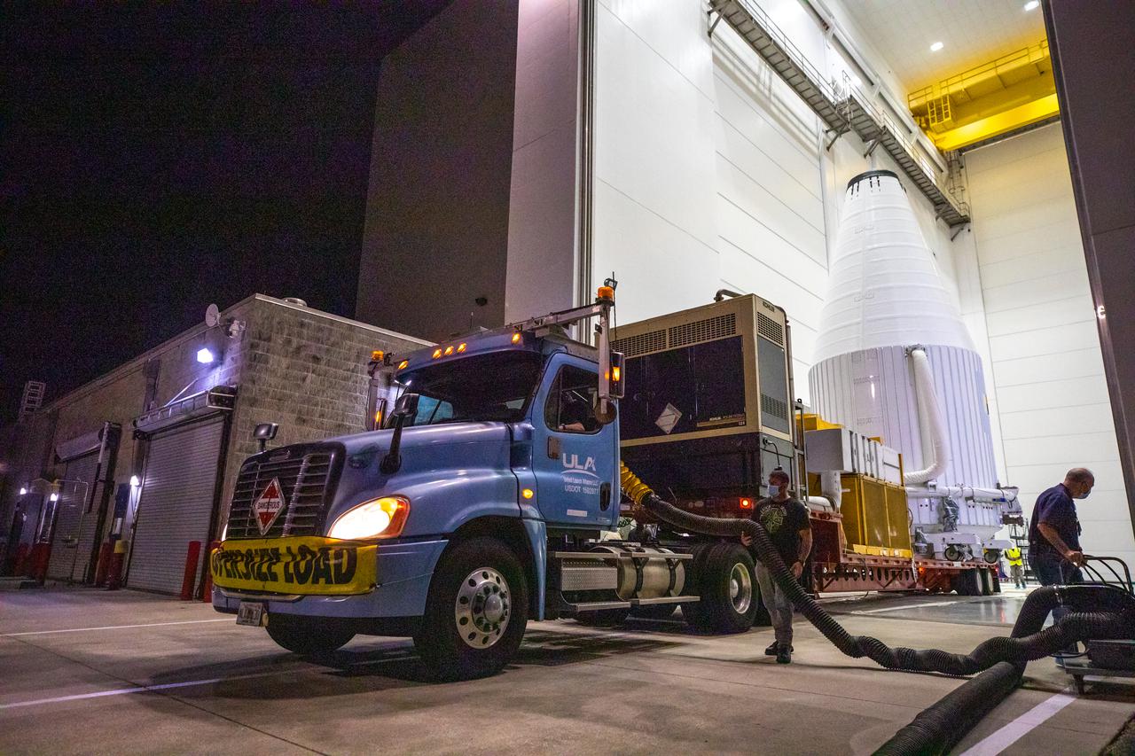 The Lucy spacecraft, encapsulated in its payload fairing, exits the Astrotech Space Operations Facility in Titusville, Florida on Oct. 7, 2021. The spacecraft will be transported to nearby Space Launch Complex 41 at Cape Canaveral Space Force Station. The encapsulated spacecraft will be hoisted up and into the Vertical Integration Facility where it will be lowered down and secured on the United Launch Alliance (ULA) Atlas V Centaur second stage.  Lucy is scheduled to launch no earlier than Saturday, Oct. 16, on the ULA Atlas V 401 rocket from Launch Pad 41. NASA’s Launch Services Program, based at Kennedy Space Center, America’s premier multi-user spaceport, is managing the launch. Over its 12-year primary mission, Lucy will explore a record-breaking number of asteroids, flying by one asteroid in the solar system’s main belt and seven Trojan asteroids. Additionally, Lucy’s path will circle back to Earth three times for gravity assists, making it the first spacecraft ever to return to the vicinity of Earth from the outer solar system.