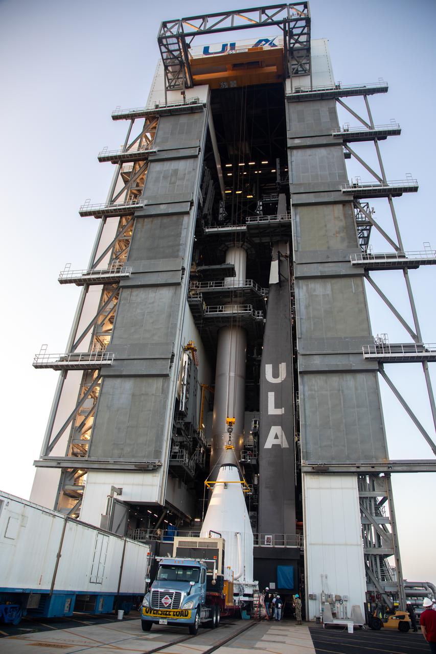 The payload fairing containing NASA’s Lucy spacecraft arrives at the Vertical Integration Facility at Space Launch Complex 41 at Cape Canaveral Space Force Station in Florida on Oct. 7, 2021. It will be hoisted up, and then lowered onto the United Launch Alliance (ULA) Atlas V Centaur second stage. Lucy is scheduled to launch no earlier than Saturday, Oct. 16, on the ULA Atlas V 401 rocket from Launch Pad 41. NASA’s Launch Services Program, based at Kennedy Space Center, America’s premier multi-user spaceport, is managing the launch. Over its 12-year primary mission, Lucy will explore a record-breaking number of asteroids, flying by one asteroid in the solar system’s main belt and seven Trojan asteroids. Additionally, Lucy’s path will circle back to Earth three times for gravity assists, making it the first spacecraft ever to return to the vicinity of Earth from the outer solar system.