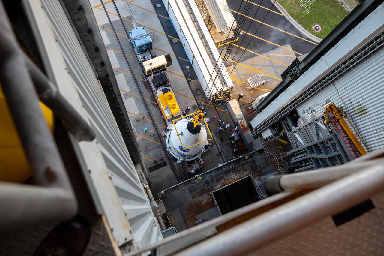 The payload fairing containing NASA’s Lucy spacecraft is hoisted up at the Vertical Integration Facility at Space Launch Complex 41 at Cape Canaveral Space Force Station in Florida on Oct. 7, 2021. It will be lowered onto the United Launch Alliance (ULA) Atlas V Centaur second stage. Lucy is scheduled to launch no earlier than Saturday, Oct. 16, on the ULA Atlas V 401 rocket from Launch Pad 41. NASA’s Launch Services Program, based at Kennedy Space Center, America’s premier multi-user spaceport, is managing the launch. Over its 12-year primary mission, Lucy will explore a record-breaking number of asteroids, flying by one asteroid in the solar system’s main belt and seven Trojan asteroids. Additionally, Lucy’s path will circle back to Earth three times for gravity assists, making it the first spacecraft ever to return to the vicinity of Earth from the outer solar system.