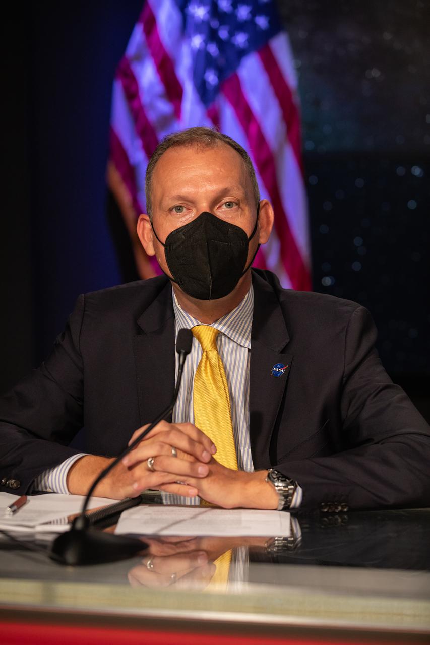 Thomas Zurbuchen, associate administrator, NASA’s Science Mission Directorate, is introduced during a prelaunch news conference for the Lucy mission held inside the TV Auditorium at NASA’s Kennedy Space Center in Florida on Oct. 13, 2021. The mission is scheduled to launch no earlier than 5:34 a.m. EDT Saturday, Oct. 16, on a United Launch Alliance Atlas V 401 rocket from Space Launch Complex 41 at Cape Canaveral Space Force Station. NASA’s Launch Services Program, based at Kennedy, is managing the launch. During its 12-year primary mission, Lucy will explore a record-breaking number of asteroids, flying by one asteroid in the solar system’s main belt and seven Trojan asteroids. Additionally, Lucy’s path will circle back to Earth three times for gravity assists, making it the first spacecraft to return to the vicinity of Earth from the outer solar system.