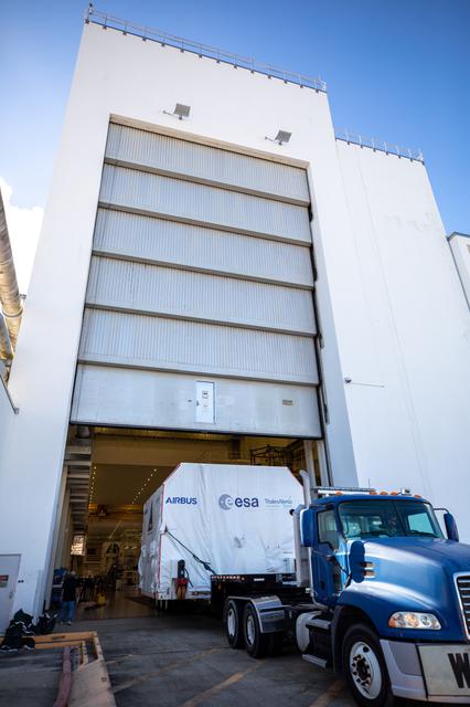 NASA image: Artemis II - ESM Arrival, Offload, and Transport to O&C Building