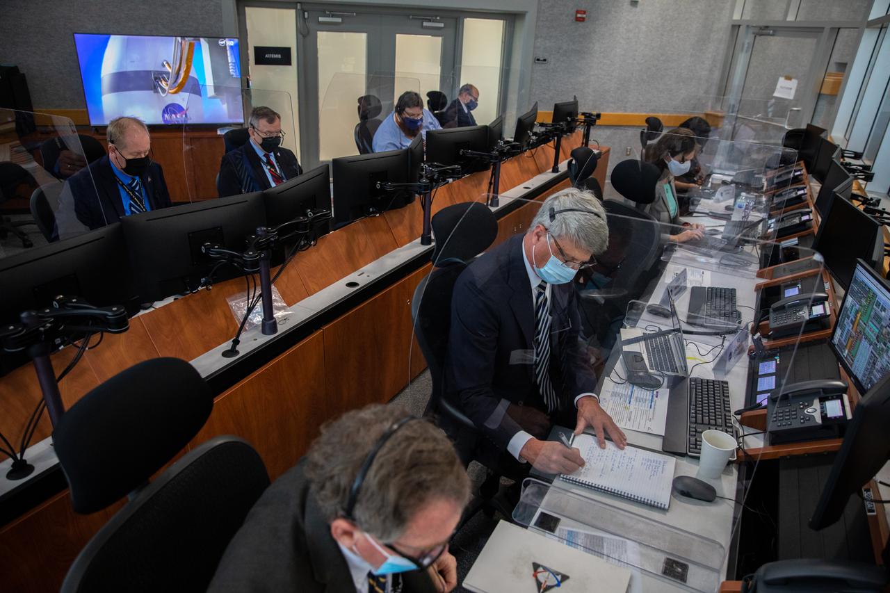 Mike Bolger; front; manager; NASA’s Exploration Ground Systems; and Chris Cianciola; NASA’s Space Launch System Program deputy manager at Marshall Space Flight Center; participate in the 11th terminal countdown simulation for the Artemis I launch inside Kennedy Space Center’s Launch Control Center on Oct. 14; 2021. The event marked the first time members of NASA’s mission management team; launch team; and contractor Jacobs conducted the simulation together. During Artemis I; the agency’s Orion spacecraft will lift off from Kennedy aboard NASA’s most powerful rocket – the Space Launch System – to fly farther than any spacecraft built for humans has ever flown. Through NASA’s Artemis missions; the agency; along with commercial and international partners; will establish a sustainable human presence on the Moon to prepare for missions to Mars.