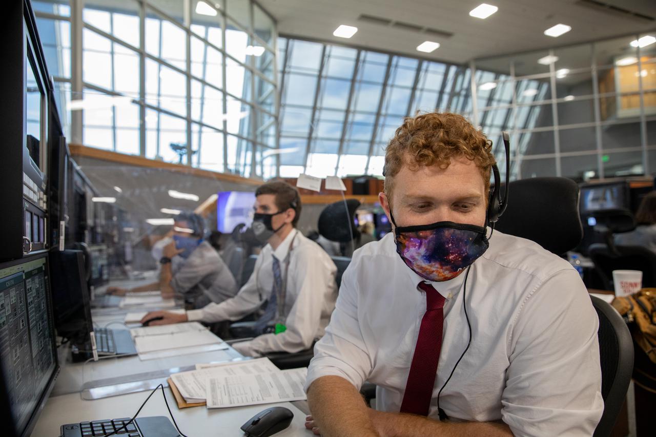 From left, Scott Cieslak, NASA umbilical operations and testing technical lead, and Elliot Payne, arms & umbilical systems and optics engineer for contractor Jacobs, participate in the 11th terminal countdown simulation for the Artemis I launch inside Kennedy Space Center’s Launch Control Center on Oct. 14, 2021. The event marked the first time members of NASA’s mission management team, launch team, and Jacobs conducted the simulation together. During Artemis I, the agency’s Orion spacecraft will lift off from Kennedy aboard NASA’s most powerful rocket – the Space Launch System – to fly farther than any spacecraft built for humans has ever flown. Through NASA’s Artemis missions, the agency, along with commercial and international partners, will establish a sustainable human presence on the Moon to prepare for missions to Mars.