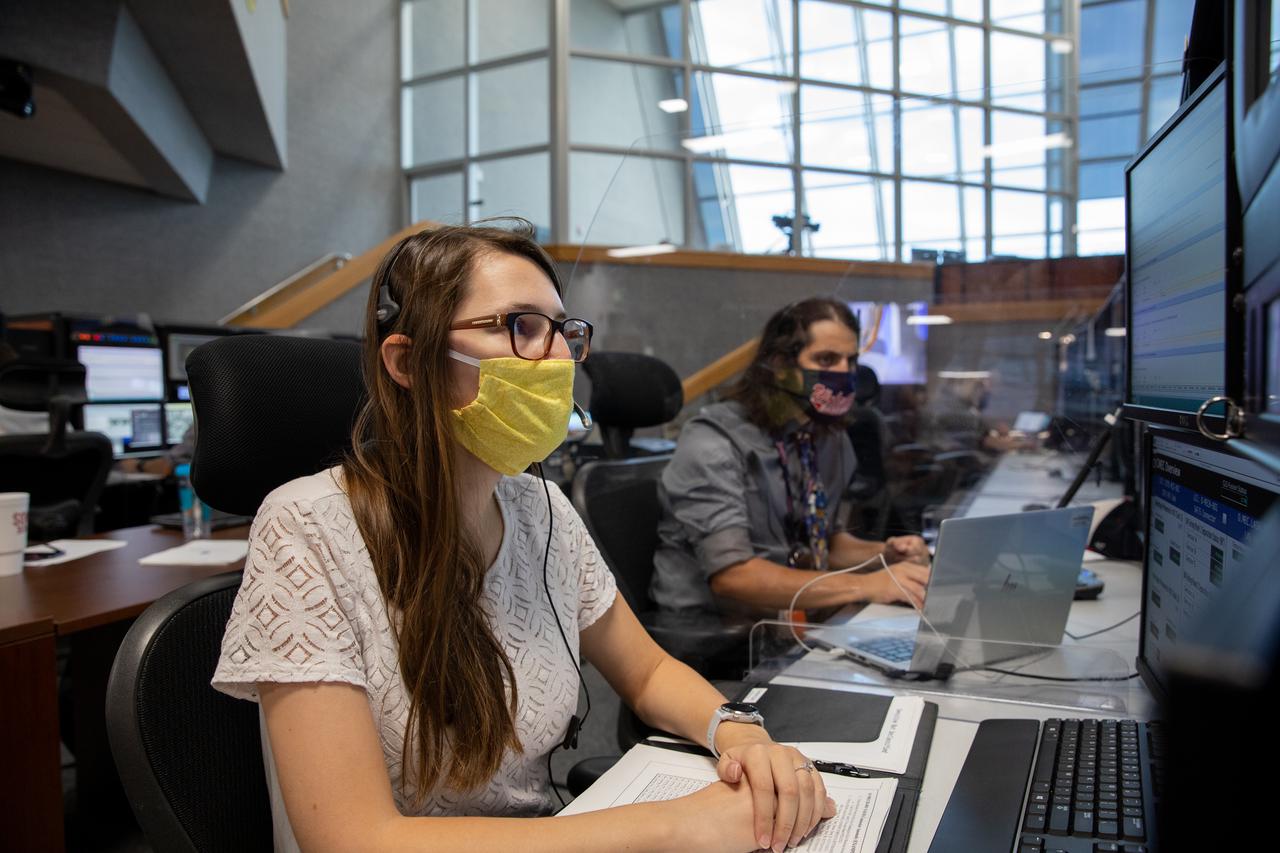 From left, Beverly Case, handling, mechanics & structures engineer for contractor Jacobs, and David Valletta, NASA ignition overpressure protection and sound suppression engineer, participate in the 11th terminal countdown simulation for the Artemis I launch inside Kennedy Space Center’s Launch Control Center on Oct. 14, 2021. The event marked the first time members of NASA’s mission management team, launch team, and Jacobs conducted the simulation together. During Artemis I, the agency’s Orion spacecraft will lift off from Kennedy aboard NASA’s most powerful rocket – the Space Launch System – to fly farther than any spacecraft built for humans has ever flown. Through NASA’s Artemis missions, the agency, along with commercial and international partners, will establish a sustainable human presence on the Moon to prepare for missions to Mars.