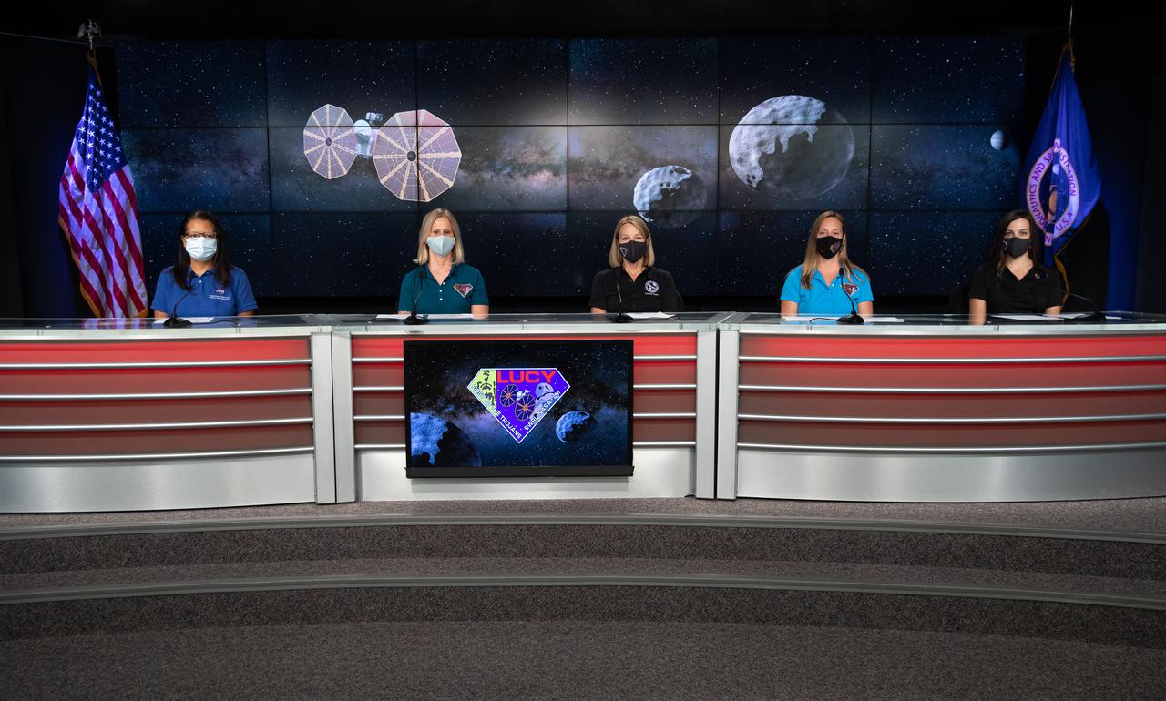 An engineering briefing for the Lucy mission is held inside the TV Auditorium at NASA’s Kennedy Space Center in Florida on Oct. 14, 2021. Participants included, from left to right, Nancy Jones, NASA Communications; Joan Salute, Planetary Science Division Associate Director, Flight Programs, NASA HQ; Katie Oakman, Lucy Structures and Mechanisms Lead, Lockheed Martin Space; Jessica Lounsbury, Lucy Project Systems Engineer at NASA’s Goddard Space Flight Center; and Coralie Adam, Deputy Navigation Team Chief, KinetX Aerospace. Lucy is scheduled to launch at 5:34 a.m. EDT Saturday, Oct. 16, on a United Launch Alliance Atlas V 401 rocket from Space Launch Complex 41 at Cape Canaveral Space Force Station. NASA’s Launch Services Program, based at Kennedy, is managing the launch. Lucy is the first space mission to study the Trojan asteroids, which hold vital clues to the formation of our solar system. 