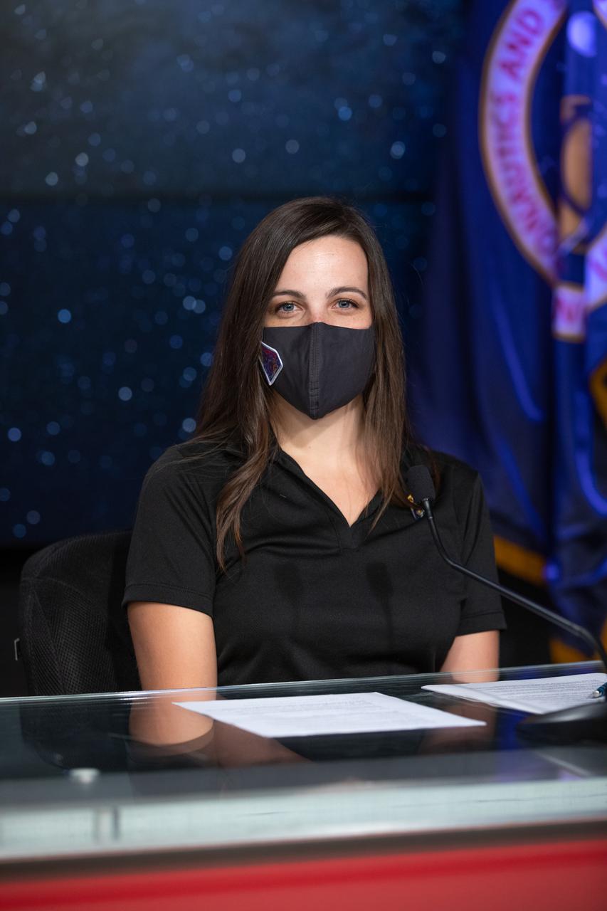 Deputy Navigation Team Chief Coralie Adam at KinetX Aerospace is introduced during an engineering briefing for the Lucy mission held inside the TV Auditorium at NASA’s Kennedy Space Center in Florida on Oct. 14, 2021. The mission is scheduled to launch at 5:34 a.m. EDT Saturday, Oct. 16, on a United Launch Alliance Atlas V 401 rocket from Space Launch Complex 41 at Cape Canaveral Space Force Station. NASA’s Launch Services Program, based at Kennedy, is managing the launch. During its 12-year primary mission, Lucy will explore a record-breaking number of asteroids, flying by one asteroid in the solar system’s main belt and seven Trojan asteroids. Additionally, Lucy’s path will circle back to Earth three times for gravity assists, making it the first spacecraft to return to the vicinity of Earth from the outer solar system. 