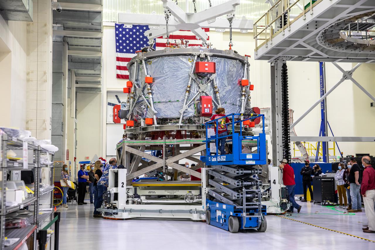 The European-built Service Module (ESM) for NASA’s Artemis II mission is shown in a work stand inside the high bay of the Neil A. Armstrong Operations and Checkout Building at NASA’s Kennedy Space Center in Florida on Oct. 15, 2021. Teams from NASA, Lockheed Martin, the European Space Agency and Airbus prepare the service module to be integrated with the Orion crew module adapter and crew module, already housed in the facility. The powerhouse that will fuel and propel Orion in space, the ESM for Artemis II will be the first Artemis mission flying crew aboard Orion.