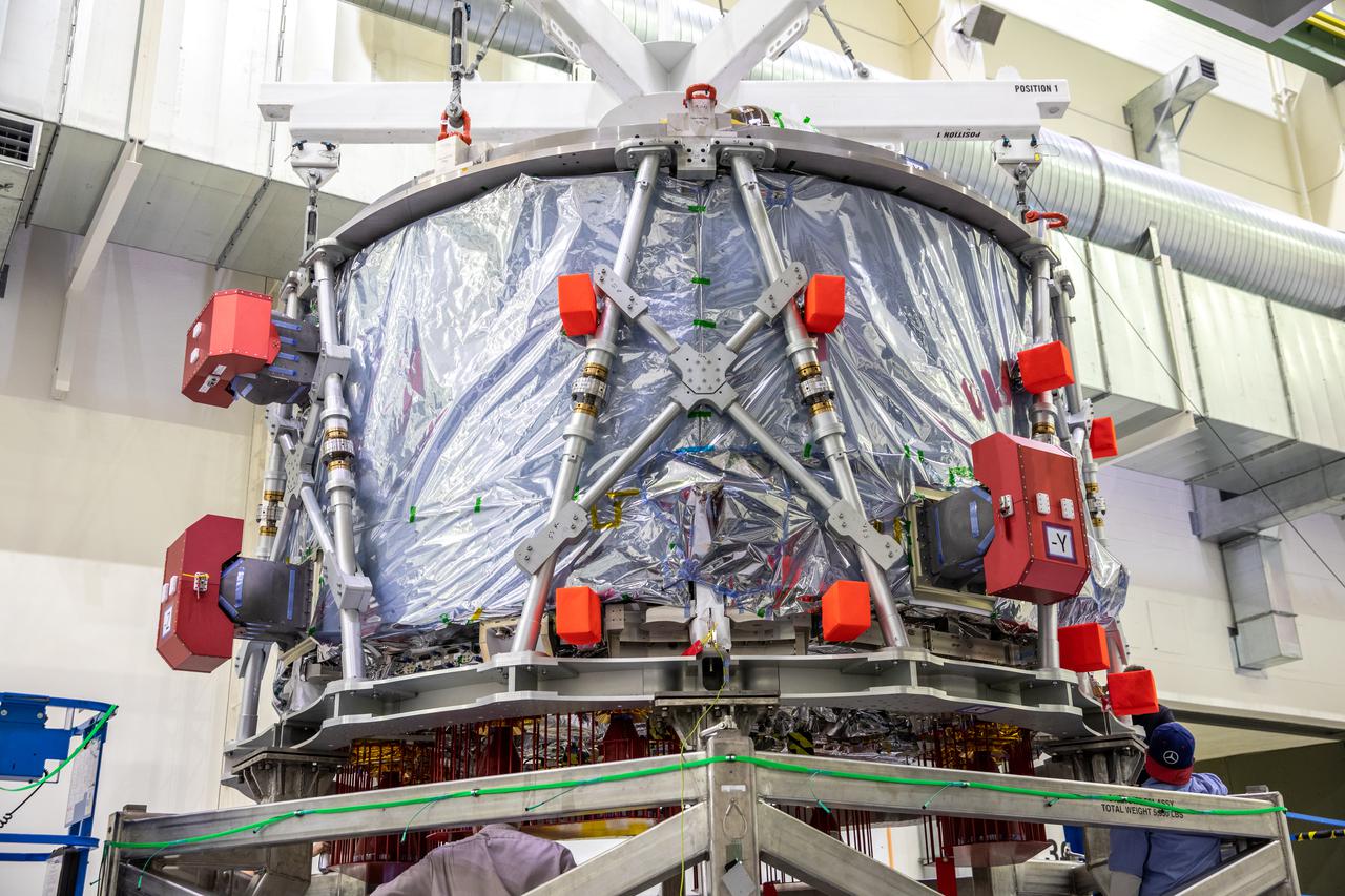 The European-built Service Module (ESM) for NASA’s Artemis II mission is shown in a work stand inside the high bay of the Neil A. Armstrong Operations and Checkout Building at NASA’s Kennedy Space Center in Florida on Oct. 15, 2021. Teams from NASA, Lockheed Martin, the European Space Agency and Airbus prepare the service module to be integrated with the Orion crew module adapter and crew module, already housed in the facility. The powerhouse that will fuel and propel Orion in space, the ESM for Artemis II will be the first Artemis mission flying crew aboard Orion.