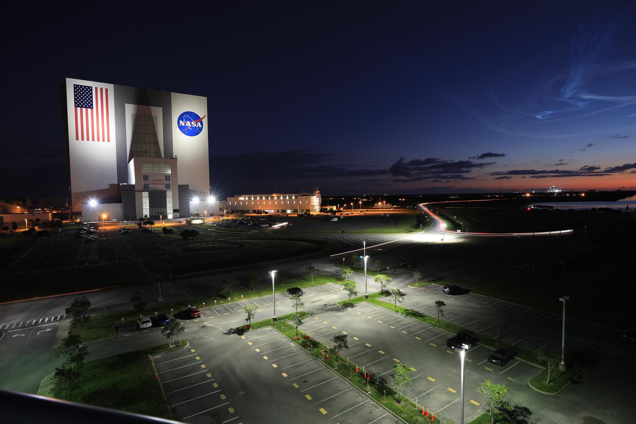 Shown is a view of the Vehicle Assembly at NASA’s Kennedy Space Center in Florida, on Oct. 16, 2021 – in the early-morning hours on the day of the Lucy mission. A United Launch Alliance V 401 rocket roared off the pad at Cape Canaveral Space Force Station’s Space Launch Complex 41 on at 5:34 a.m. EDT, carrying NASA’s Lucy spacecraft into space. During its 12-year primary mission, Lucy will explore a record-breaking number of asteroids, flying by one asteroid in the solar system’s main belt and seven Trojan asteroids. Lucy is the first space mission to study the Trojan asteroids, which hold vital clues to the formation of our solar system.