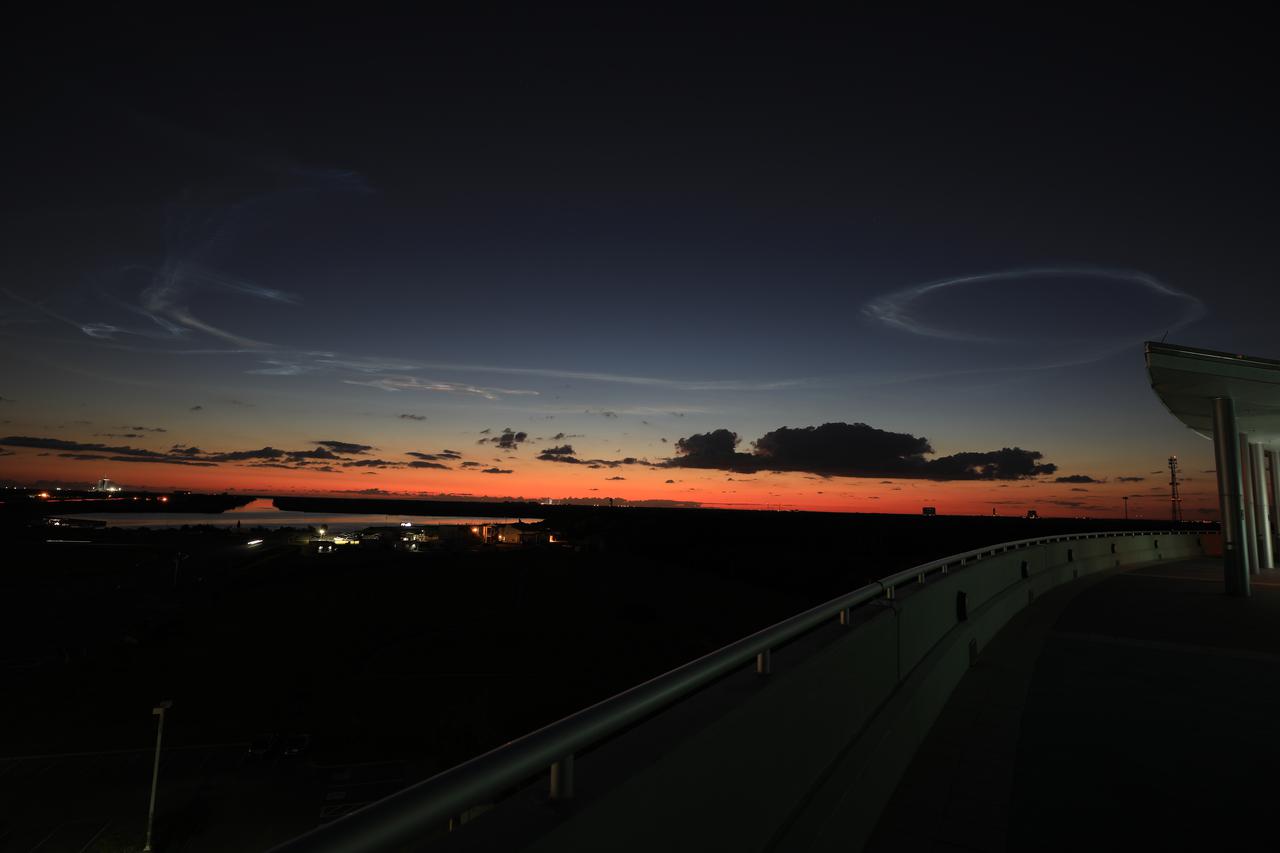Shown is a view from the Operations Support Building II at NASA’s Kennedy Space Center in Florida, on Oct. 16, 2021 – in the early-morning hours on the day of the Lucy mission. A United Launch Alliance V 401 rocket roared off the pad at Cape Canaveral Space Force Station’s Space Launch Complex 41 on at 5:34 a.m. EDT, carrying NASA’s Lucy spacecraft into space. During its 12-year primary mission, Lucy will explore a record-breaking number of asteroids, flying by one asteroid in the solar system’s main belt and seven Trojan asteroids. Lucy is the first space mission to study the Trojan asteroids, which hold vital clues to the formation of our solar system.