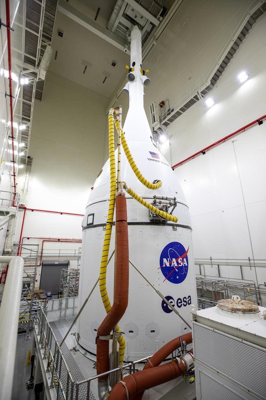 Inside the Launch Abort System Facility (LASF) at NASA’s Kennedy Space Center in Florida, the fully assembled Orion spacecraft for the agency’s Artemis I mission is prepared for transport on Oct. 18, 2021. In the early morning hours of Oct. 19, Orion was moved from the LASF into the Vehicle Assembly Building, where teams with the agency’s Exploration Ground Systems and contractor Jacobs will lift and lower the spacecraft on top of the Space Launch System (SLS) rocket to complete assembly of NASA’s Moon rocket. The first in an increasingly complex set of missions, Artemis I will be an integrated flight test for Orion and SLS ahead of crewed flights to the Moon.
