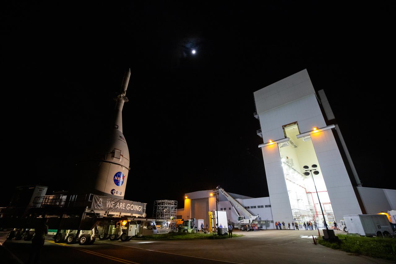The Orion spacecraft for NASA’s Artemis I mission, fully assembled with its launch abort system, moves out of the Launch Abort System Facility at Kennedy Space Center in Florida on Oct. 19, 2021. Orion will be transported to the Vehicle Assembly Building where it will join the already stacked flight hardware and be raised into position atop the Space Launch System rocket in High Bay 3. Launching in 2021, Artemis I will be an uncrewed test flight of the Orion spacecraft and Space Launch System rocket as an integrated system ahead of crewed flights to the Moon. Under Artemis, NASA aims to land the first woman and first person of color on the Moon and establish sustainable lunar exploration.