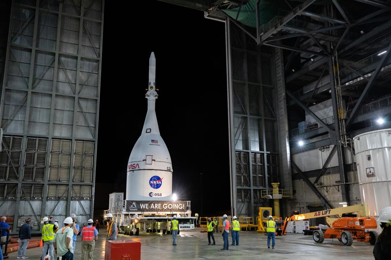 The Orion spacecraft for NASA’s Artemis I mission, fully assembled with its launch abort system, is moved into the transfer aisle of the Vehicle Assembly Building (VAB) at Kennedy Space Center in Florida on Oct. 19, 2021. In the VAB, Orion will join the already stacked flight hardware and be raised into position atop the Space Launch System rocket in High Bay 3. Launching in 2021, Artemis I will be an uncrewed test flight of the Orion spacecraft and Space Launch System rocket as an integrated system ahead of crewed flights to the Moon. Under Artemis, NASA aims to land the first woman and first person of color on the Moon and establish sustainable lunar exploration. 