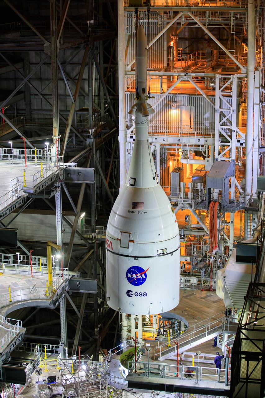 The Orion spacecraft for NASA’s Artemis I mission, fully assembled with its launch abort system, was  lowered on top of the Space Launch System (SLS) rocket in High Bay 3 of the Vehicle Assembly Building at Kennedy Space Center in Florida on Oct. 20, 2021. The stacking of Orion on top of the SLS completes assembly for the Artemis I flight test. Teams will begin conducting a series of verification tests ahead of rolling out to Launch Complex 39B for the Wet Dress Rehearsal. Artemis I will be an uncrewed test flight of the Orion spacecraft and Space Launch System rocket as an integrated system ahead of crewed flights to the Moon. Under Artemis, NASA aims to land the first woman and first person of color on the Moon and establish sustainable lunar exploration. 