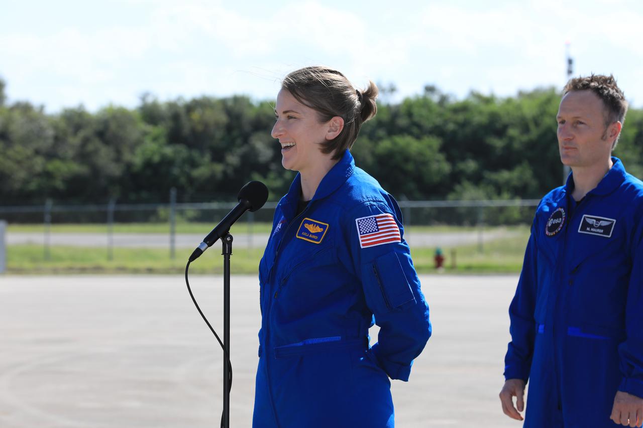NASA astronaut Kayla Barron speaks to members of the news media during crew arrival for NASA’s SpaceX Crew-3 mission at Kennedy Space Center’s Launch and Landing Facility in Florida on Oct. 26, 2021. Barron, along with NASA astronauts Raja Chari, and Tom Marshburn, and European Space Agency astronaut Matthias Maurer arrived at the landing facility from Houston. The astronauts will launch aboard the Crew Dragon on a SpaceX Falcon 9 rocket on Oct. 31. Launch is targeted for 2:21 a.m. from Launch Complex 39A. Crew-3 is the third crew rotation flight for the agency’s Commercial Crew Program, and the first flight of a new Crew Dragon spacecraft.