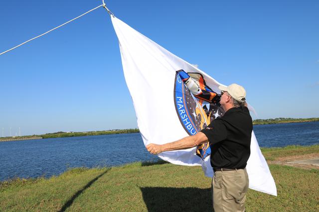 NASA image: Crew-3 Flag Raising by Countdown Clock