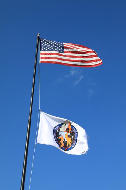 NASA image: Crew-3 Flag Raising by Countdown Clock