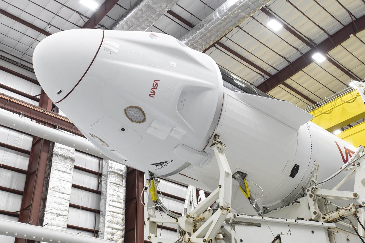 Inside the SpaceX horizontal processing facility at NASA’s Kennedy Space Center in Florida, the SpaceX Falcon 9 rocket with Crew Dragon attached are ready for rollout to Launch Complex 39A on Oct. 27, 2021 for NASA’s SpaceX Crew-3 mission. NASA astronauts Raja Chari, Tom Marshburn and Kayla Barron, along with Matthias Maurer, European Space Agency astronaut, will launch aboard the Crew Dragon on the Falcon 9 rocket on Oct. 31. Launch is targeted for 2:21 a.m. from Pad 39A. Crew-3 is the third crew rotation flight for the agency’s Commercial Crew Program, and the first flight of a new Crew Dragon spacecraft.