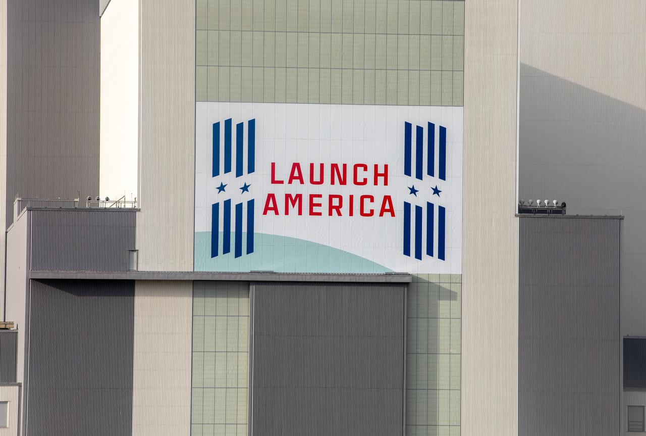 Seen here is the “Launch America” banner for NASA’s Commercial Crew Program (CCP) on the iconic Vehicle Assembly Building at the agency’s Kennedy Space Center in Florida on Oct. 28, 2021. NASA and SpaceX are preparing for Crew-3 – the third crew rotation flight to the International Space Station for CCP – and part of that includes conducting a dress rehearsal ahead of launch. On Oct. 28, NASA’s SpaceX Crew-3 astronauts and launch teams rehearsed countdown operations, concluding with the Go/No-Go poll for Falcon-9 fueling. The Crew-3 mission will carry NASA astronauts Raja Chari, Tom Marshburn, and Kayla Barron, as well as ESA (European Space Agency) astronaut Matthias Maurer to the space station for a six-month stay. SpaceX’s Falcon 9 rocket and Crew Dragon spacecraft are scheduled to lift off from Kennedy’s Launch Complex 39A no earlier than Nov. 6 at 11:36 p.m. EDT.