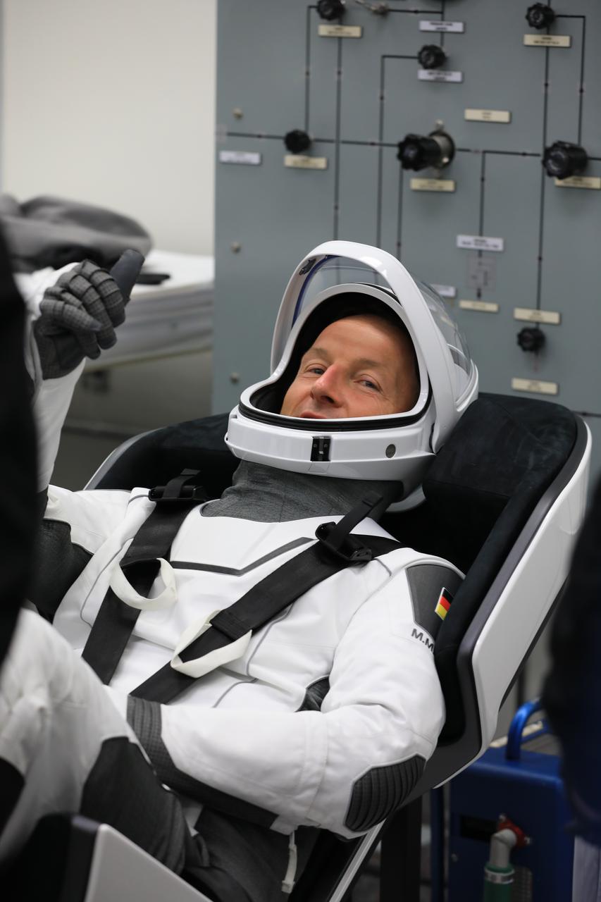 SpaceX Crew-3 astronaut Matthias Maurer, with the European Space Agency and mission specialist,  participates in a countdown dress rehearsal at the agency’s Kennedy Space Center in Florida on Oct. 28, 2021, to prepare for the upcoming Crew-3 launch. Maurer runs through checkouts of his SpaceX spacesuit inside the crew suit-up room in the Neil A. Armstrong Operations and Checkout Building. Maurer, along with NASA crew members Raja Chari, commander, Kayla Barron, mission specialist, and Tom Marshburn, pilot, will launch aboard the Crew Dragon atop the Falcon 9 to the International Space Station. Launch is targeted for no earlier than Nov. 6 at 11:36 p.m. EDT from Launch Complex 39A. Crew-3 is the third crew rotation flight to the space station for NASA’s Commercial Crew Program, and the first flight of a new Crew Dragon spacecraft. 