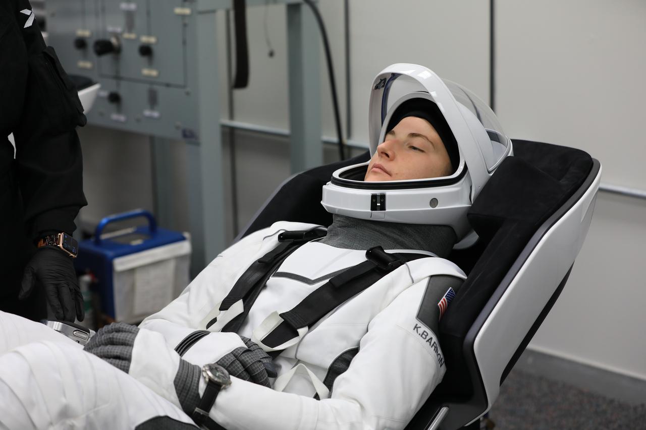 NASA’s SpaceX Crew-3 astronauts participate in a countdown dress rehearsal at the agency’s Kennedy Space Center in Florida on Oct. 28, 2021, to prepare for the upcoming Crew-3 launch. Kayla Barron, mission specialist, runs through checkouts of her SpaceX spacesuit inside the crew suitup room in the Neil A. Armstrong Operations and Checkout Building. Barron, along with Raja Chari, commander, Tom Marshburn, pilot, and Matthias Maurer, mission specialist with the European Space Agency, will launch aboard the Crew Dragon atop the Falcon 9 to the International Space Station. Launch is targeted for no earlier than Nov. 6 at 11:36 p.m. EDT from Launch Complex 39A. Crew-3 is the third crew rotation flight to the space station for NASA’s Commercial Crew Program, and the first flight of a new Crew Dragon spacecraft.