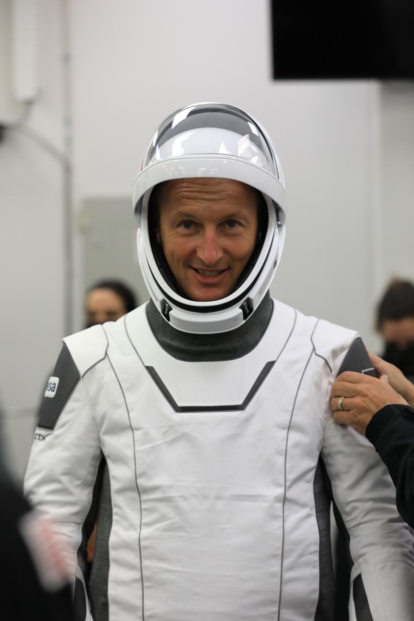 NASA’s SpaceX Crew-3 astronauts participate in a countdown dress rehearsal at the agency’s Kennedy Space Center in Florida on Oct. 28, 2021, to prepare for the upcoming Crew-3 launch. NASA astronaut Tom Marshburn, pilot, runs through checkouts of his SpaceX spacesuit inside the crew suitup room in the Neil A. Armstrong Operations and Checkout Building. Marshburn,  along with Raja Chari, commander, Kayla Barron, mission specialist, and European Space Agency astronaut Matthias Maurer, also a mission specialist, will launch aboard the Crew Dragon atop the Falcon 9 to the International Space Station. Launch is targeted for no earlier than Nov. 6 at 11:36 p.m. EDT from Launch Complex 39A. Crew-3 is the third crew rotation flight to the space station for NASA’s Commercial Crew Program, and the first flight of a new Crew Dragon spacecraft. 