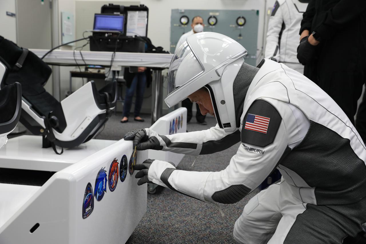 NASA’s SpaceX Crew-3 astronauts participate in a countdown dress rehearsal at the agency’s Kennedy Space Center in Florida on Oct. 28, 2021, to prepare for the upcoming Crew-3 launch. The astronauts are in the crew suitup room inside the Neil A. Armstrong Operations and Checkout Building completing suit checkouts. NASA astronauts Raja Chari, commander, Tom Marshburn, pilot, Kayla Barron, mission specialist, and European Space Agency astronaut Matthias Maurer, also a mission specialist, will launch aboard the Crew Dragon atop the Falcon 9 to the International Space Station. Launch is targeted for no earlier than Nov. 6, at 11:36 p.m. EDT from Launch Complex 39A. Crew-3 is the third crew rotation flight to the space station for NASA’s Commercial Crew Program, and the first flight of a new Crew Dragon spacecraft.