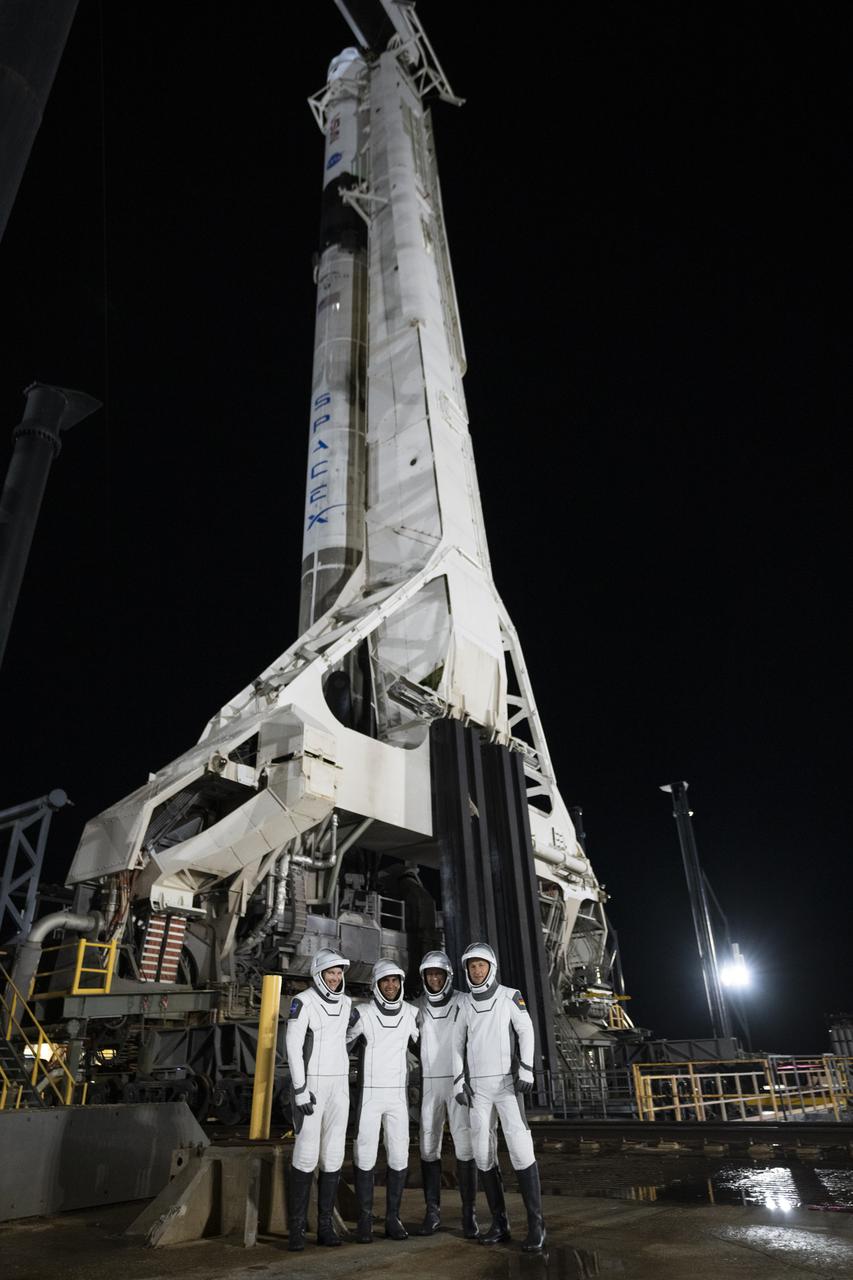 NASA’s SpaceX Crew-3 astronauts participate in a countdown dress rehearsal at the agency’s Kennedy Space Center in Florida on Oct. 28, 2021, to prepare for the upcoming Crew-3 launch. The astronauts are at Launch Pad 39A with the Falcon 9 and Crew Dragon behind them during the rehearsal. From left are NASA astronauts Kayla Barron, Raja Chari, Crew-3 commander, and Tom Marshburn, and European Space Agency astronaut Matthias Maurer. The four-person crew will launch aboard the Crew Dragon atop the Falcon 9 on Oct. 31 to the International Space Station. Launch is targeted for 2:21 a.m. EDT from Pad 39A. Crew-3 is the third crew rotation flight to the space station for NASA’s Commercial Crew Program, and the first flight of a new Crew Dragon spacecraft. 