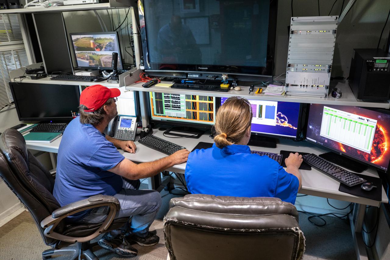 Weather Instrumentation Technician Gavin Oglesby, left, and Weather Instrumentation Engineer Nick O’Connor work with the Tropospheric Doppler Radar Wind Profiler at Kennedy Space Center in Florida during an Artemis I weather simulation on Nov. 3, 2021. The simulation involved teams from Kennedy, Cape Canaveral Space Force Station, Johnson Space Center in Texas, and Marshall Space Flight Center in Alabama. The radar wind profiler delivers data – from 6,000 to 62,000 feet – every five minutes. It will be used as the primary upper level wind instrument for NASA’s Artemis missions, including Artemis I, the first launch of the agency’s Space Launch System rocket and the Orion spacecraft on a flight beyond the Moon.