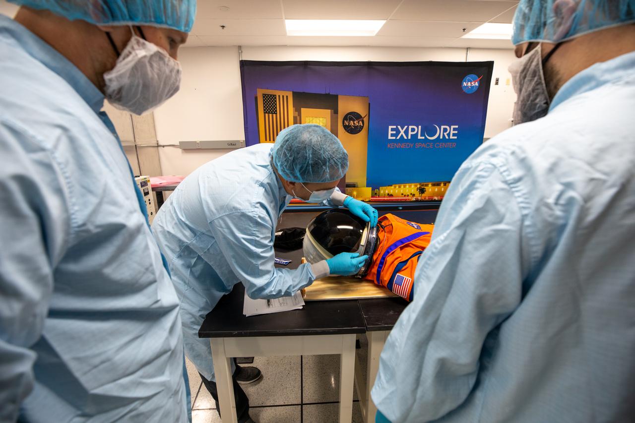 Inside the Space Station Processing Facility at NASA’s Kennedy Space Center in Florida, teams from Johnson Space Center, Exploration Ground Systems, and Jacobs TOSC conduct final inspections of Moonikin “Campos” on Nov. 9, 2021, prior to installation into the Orion crew module. Technicians checked connectivity and performed fit checks on his flight suit to ensure he is ready for flight aboard the Artemis flight test. Artemis I will be an uncrewed test flight of the Orion spacecraft and Space Launch System rocket as an integrated system ahead of crewed flights to the Moon. Under Artemis, NASA aims to land the first woman and first person of color on the Moon and establish sustainable lunar exploration. 