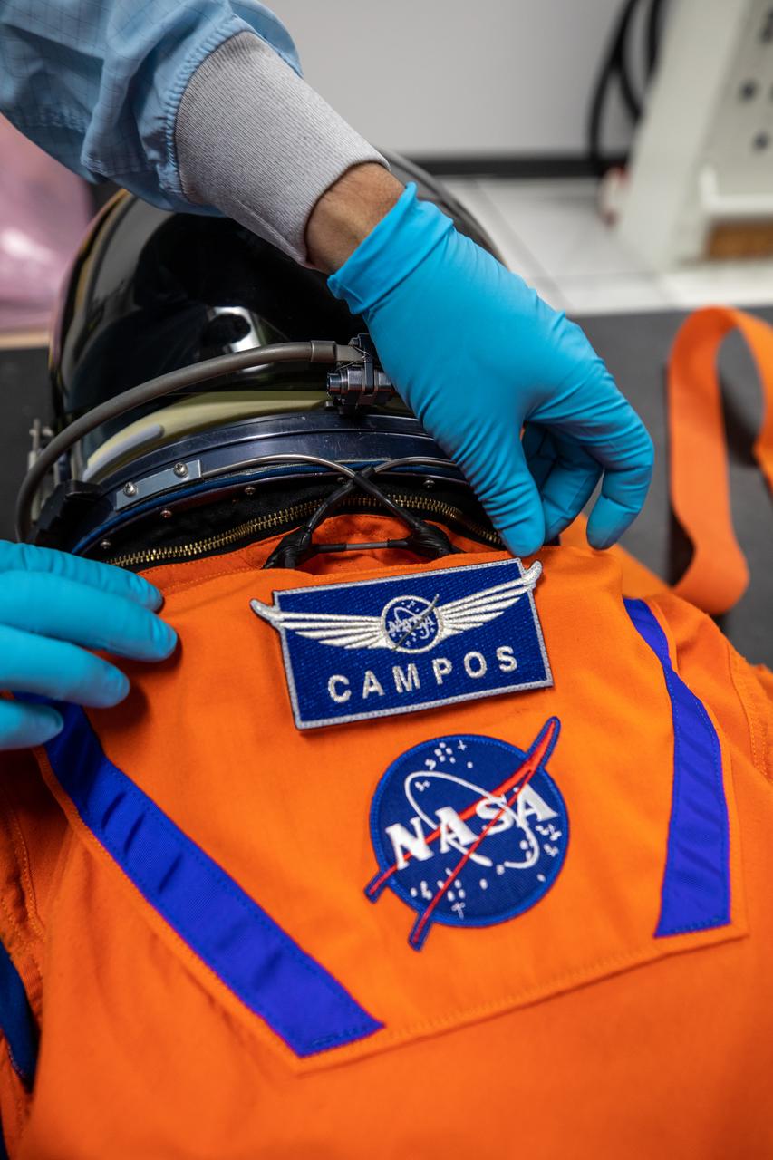 Teams from Johnson Space Center, Exploration Ground Systems, and Jacobs TOSC conduct final inspections of Moonikin “Campos” on Nov. 9, 2021, inside the Space Station Processing Facility at NASA’s Kennedy Space Center in Florida. Moonikin “Campos” will be installed into the Orion crew module. Technicians checked connectivity and performed fit checks on his flight suit to ensure he is ready for flight aboard the Artemis flight test. Artemis I will be an uncrewed test flight of the Orion spacecraft and Space Launch System rocket as an integrated system ahead of crewed flights to the Moon. Under Artemis, NASA aims to land the first woman and first person of color on the Moon and establish sustainable lunar exploration. 
