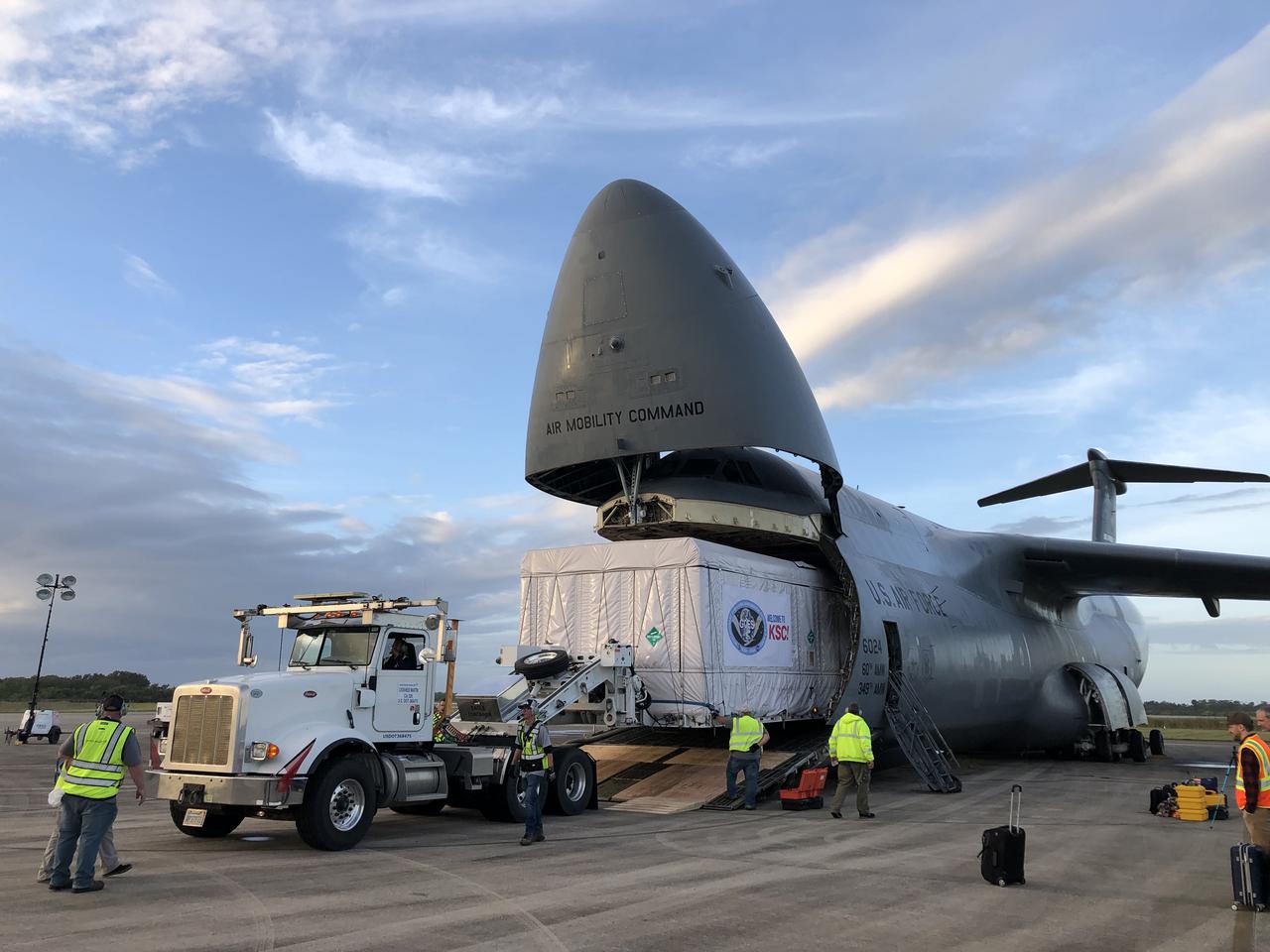 The shipping container holding the Geostationary Operational Environmental Satellite T (GOES-T) is unloaded from a United States Air Force C-5 cargo plane following its arrival at the Launch and Landing Facility runway at NASA’s Kennedy Space Center in Florida on Nov. 10, 2021. From here, teams will transport the satellite to an Astrotech Space Operations facility in nearby Titusville for prelaunch processing. A collaboration between NASA and the National Oceanic and Atmospheric Administration, GOES-T is the third satellite in the GOES-R series that will continue to help meteorologists observe and predict local weather events that affect public safety. GOES-T is scheduled to launch aboard a United Launch Alliance Atlas V rocket from Cape Canaveral Space Force Station on March 1, 2022. The launch is being managed by NASA’s Launch Services Program based at Kennedy, America’s multi-user spaceport.
