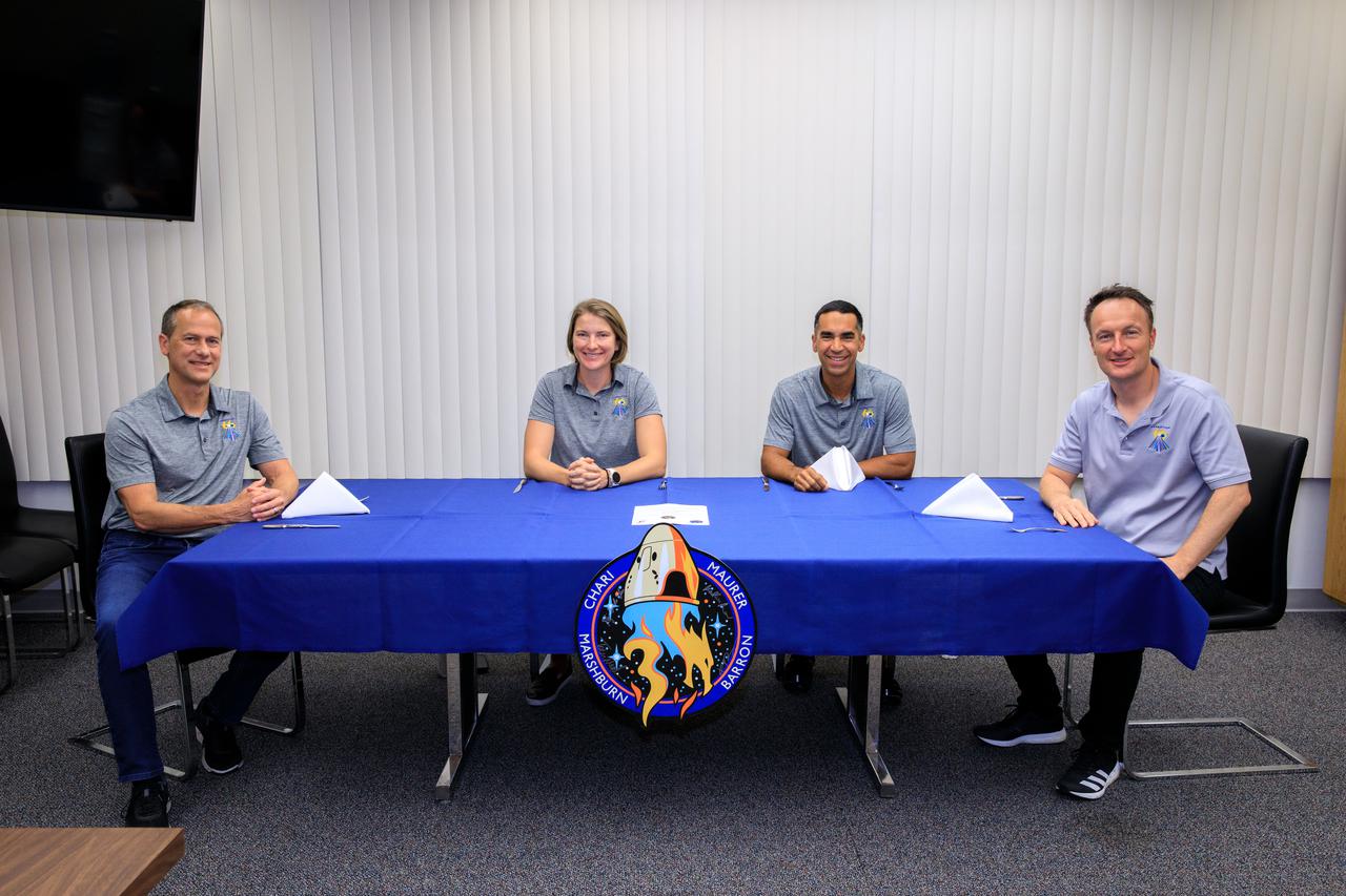 On launch day, Nov. 10, 2021, the SpaceX Crew-3 astronauts are ready for breakfast in the dining room of the Astronaut Crew Quarters inside the Neil Armstrong Operations and Checkout Building at NASA’s Kennedy Space Center in Florida. From left are NASA astronauts Tom Marshburn, pilot; Kayla Barron, mission specialist; Raja Chari, commander; and Matthias Maurer, ESA (European Space Agency) astronaut and mission specialist. The Falcon 9 rocket with Crew Dragon Endurance will launch the four-person crew to the International Space Station for NASA’s Commercial Crew Program. Crew-3 is scheduled to launch Nov. 10 at 9:03 p.m. EST from Launch Complex 39A at Kennedy.