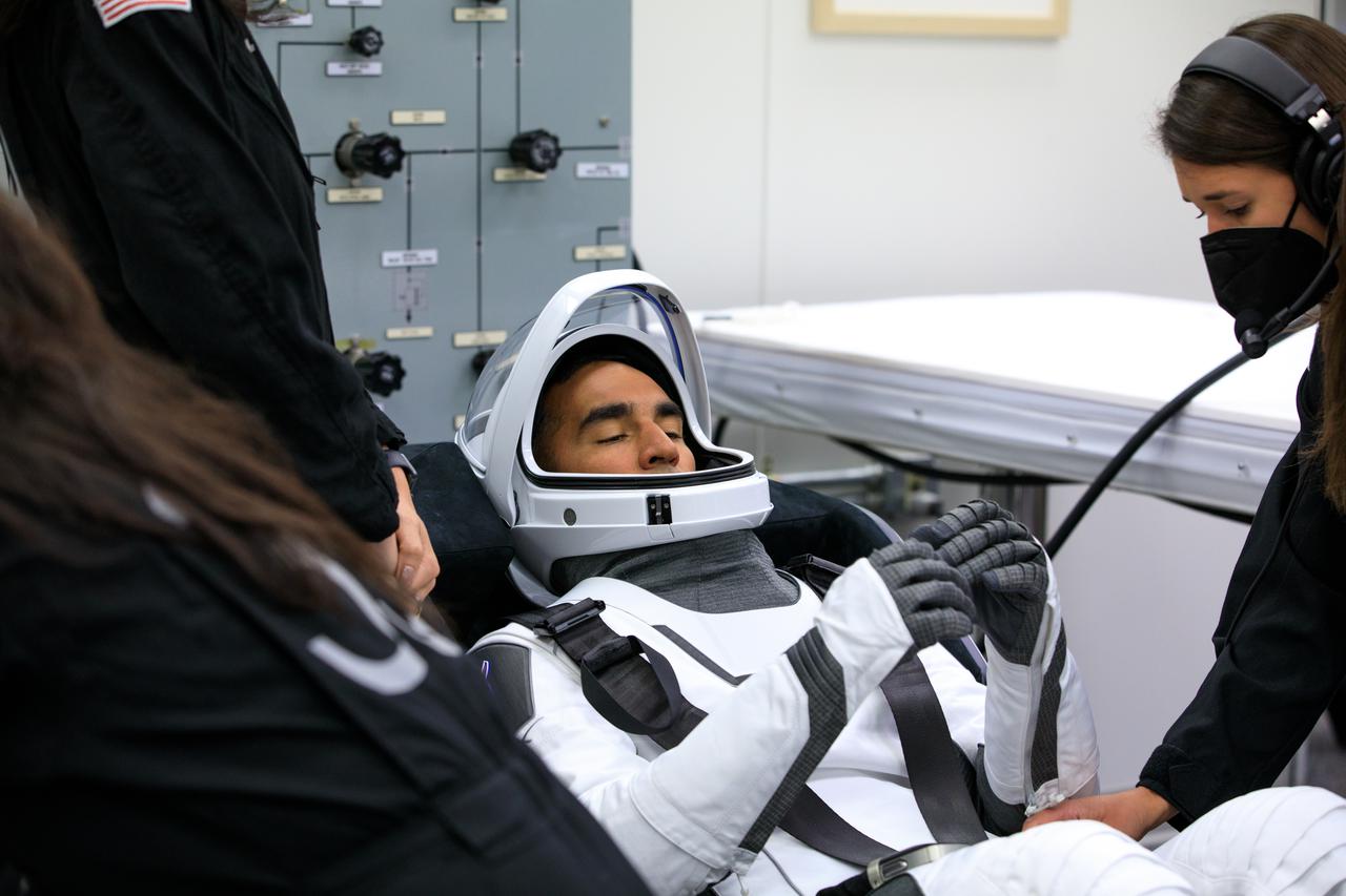 NASA SpaceX Crew-3 mission astronauts are in the suit-up room in the Astronaut Crew Quarters inside Kennedy Space Center’s Neil A. Armstrong Operations and Checkout Building on launch day, Nov. 10, 2021. A team of SpaceX suit technicians will help them as they put on their custom-fitted spacesuits and check the suits for leaks. In view is NASA astronaut Raja Chari, commander. The Falcon 9 rocket with Crew Dragon Endurance will launch the four-person crew to the International Space Station for NASA’s Commercial Crew Program. Crew-3 is scheduled to launch at 9:03 p.m. EST from Launch Complex 39A at Kennedy. 