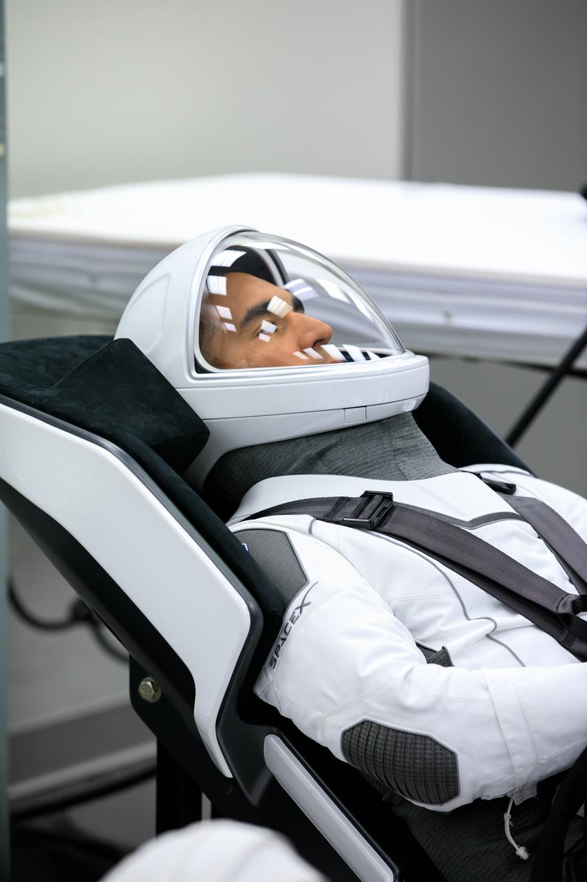 NASA SpaceX Crew-3 mission astronauts are in the suit-up room in the Astronaut Crew Quarters inside Kennedy Space Center’s Neil A. Armstrong Operations and Checkout Building on launch day, Nov. 10, 2021. A team of SpaceX suit technicians will help them as they put on their custom-fitted spacesuits and check the suits for leaks. In view is NASA astronaut Tom Marshburn, pilot. The Falcon 9 rocket with Crew Dragon Endurance will launch the four-person crew to the International Space Station for NASA’s Commercial Crew Program. Crew-3 is scheduled to launch at 9:03 p.m. EST from Launch Complex 39A at Kennedy. 