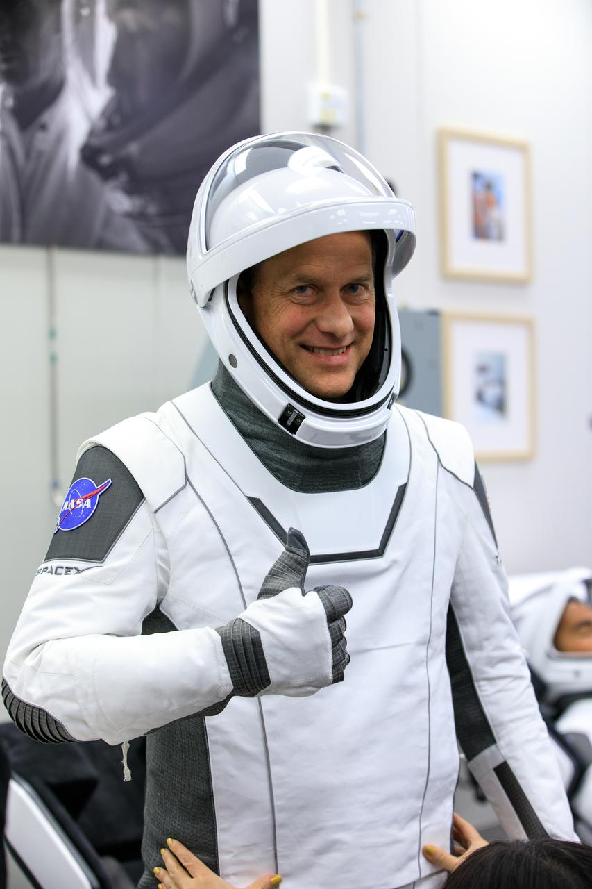 NASA SpaceX Crew-3 mission astronauts are in the suit-up room in the Astronaut Crew Quarters inside Kennedy Space Center’s Neil A. Armstrong Operations and Checkout Building on launch day, Nov. 10, 2021. A team of SpaceX suit technicians will help them as they put on their custom-fitted spacesuits and check the suits for leaks. In view is NASA astronaut Tom Marshburn, pilot. The Falcon 9 rocket with Crew Dragon Endurance will launch the four-person crew to the International Space Station for NASA’s Commercial Crew Program. Crew-3 is scheduled to launch at 9:03 p.m. EST from Launch Complex 39A at Kennedy. 