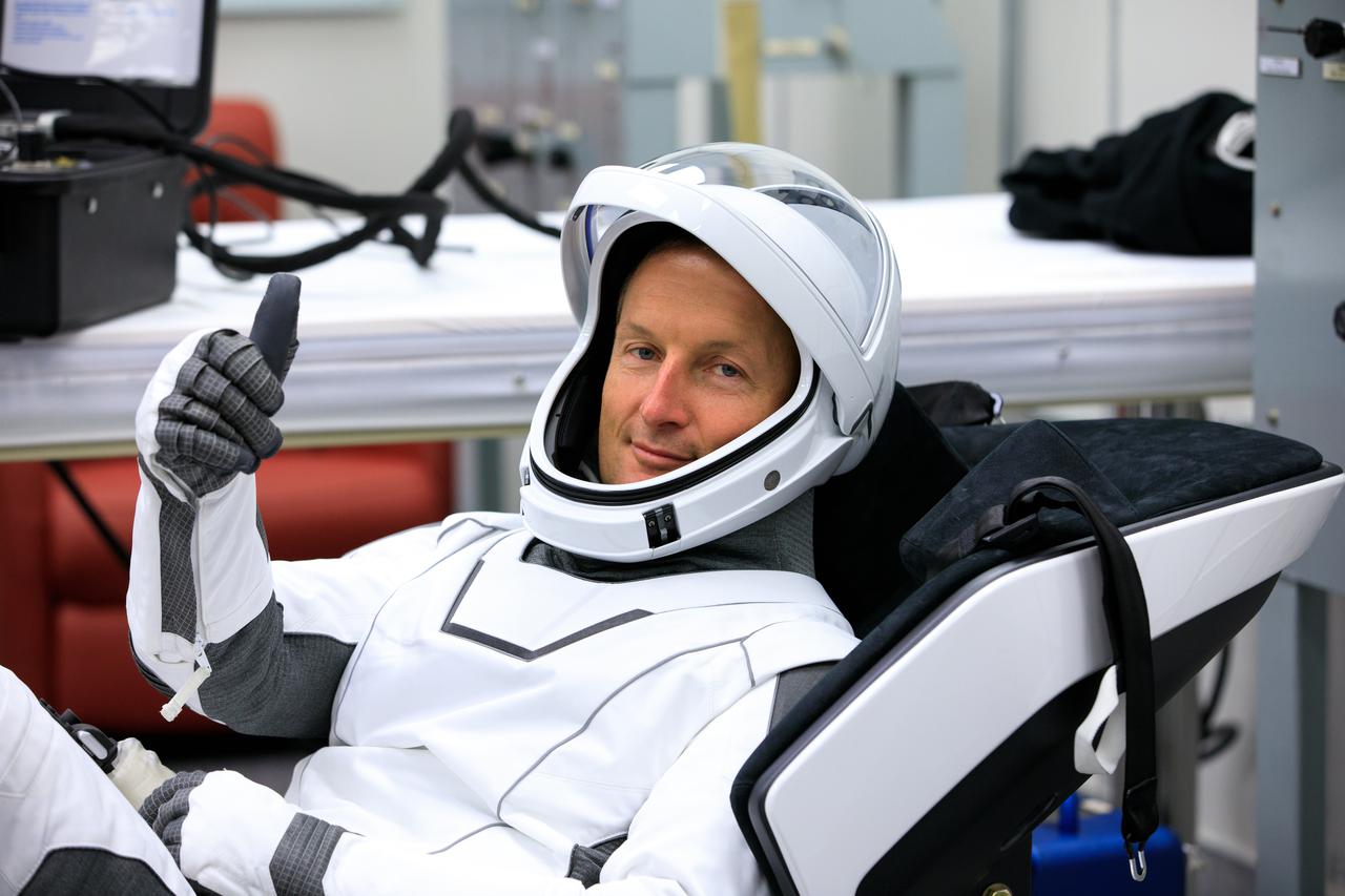 NASA SpaceX Crew-3 mission astronauts are in the suit-up room in the Astronaut Crew Quarters inside Kennedy Space Center’s Neil A. Armstrong Operations and Checkout Building on launch day, Nov. 10, 2021. A team of SpaceX suit technicians will help them as they put on their custom-fitted spacesuits and check the suits for leaks. In view is Matthias Maurer, ESA (European Space Agency) astronaut and mission specialist. The Falcon 9 rocket with Crew Dragon Endurance will launch the four-person crew to the International Space Station for NASA’s Commercial Crew Program. Crew-3 is scheduled to launch at 9:03 p.m. EST from Launch Complex 39A at Kennedy. 