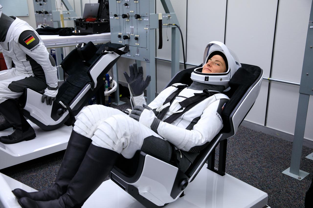 NASA SpaceX Crew-3 mission astronauts are in the suit-up room in the Astronaut Crew Quarters inside Kennedy Space Center’s Neil A. Armstrong Operations and Checkout Building on launch day, Nov. 10, 2021. A team of SpaceX suit technicians will help them as they put on their custom-fitted spacesuits and check the suits for leaks. In view is NASA astronaut Kayla Barron, mission specialist. The Falcon 9 rocket with Crew Dragon Endurance will launch the four-person crew to the International Space Station for NASA’s Commercial Crew Program. Crew-3 is scheduled to launch at 9:03 p.m. EST from Launch Complex 39A at Kennedy. 