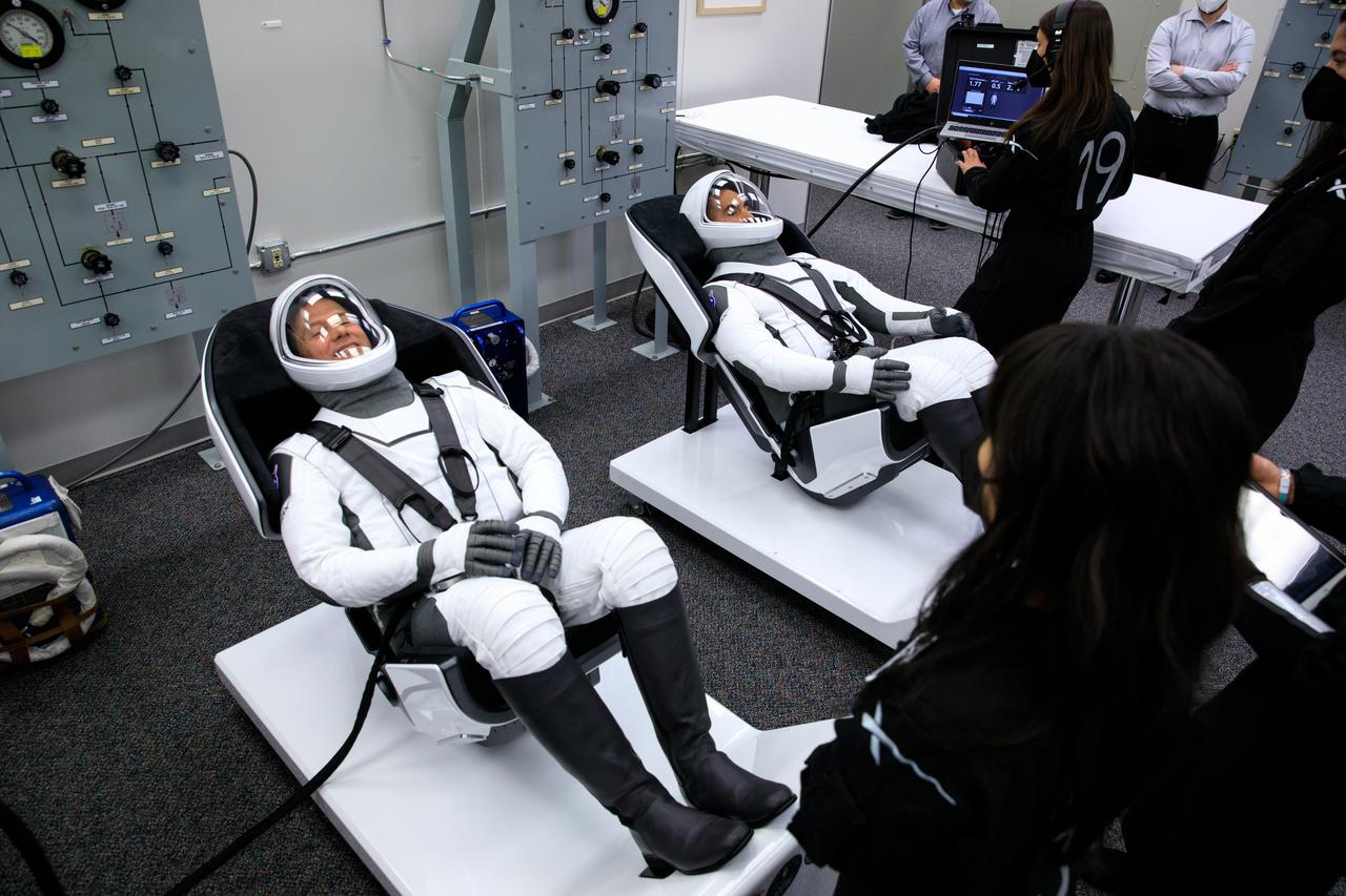 NASA SpaceX Crew-3 mission astronauts are in the suit-up room in the Astronaut Crew Quarters inside Kennedy Space Center’s Neil A. Armstrong Operations and Checkout Building on launch day, Nov. 10, 2021. A team of SpaceX suit technicians will help them as they put on their custom-fitted spacesuits and check the suits for leaks. In view, from left are Matthias Maurer, ESA (European Space Agency) astronaut and mission specialist; and NASA astronaut Kayla Barron, mission specialist. The Falcon 9 rocket with Crew Dragon Endurance will launch the four-person crew to the International Space Station for NASA’s Commercial Crew Program. Crew-3 is scheduled to launch at 9:03 p.m. EST from Launch Complex 39A at Kennedy. 