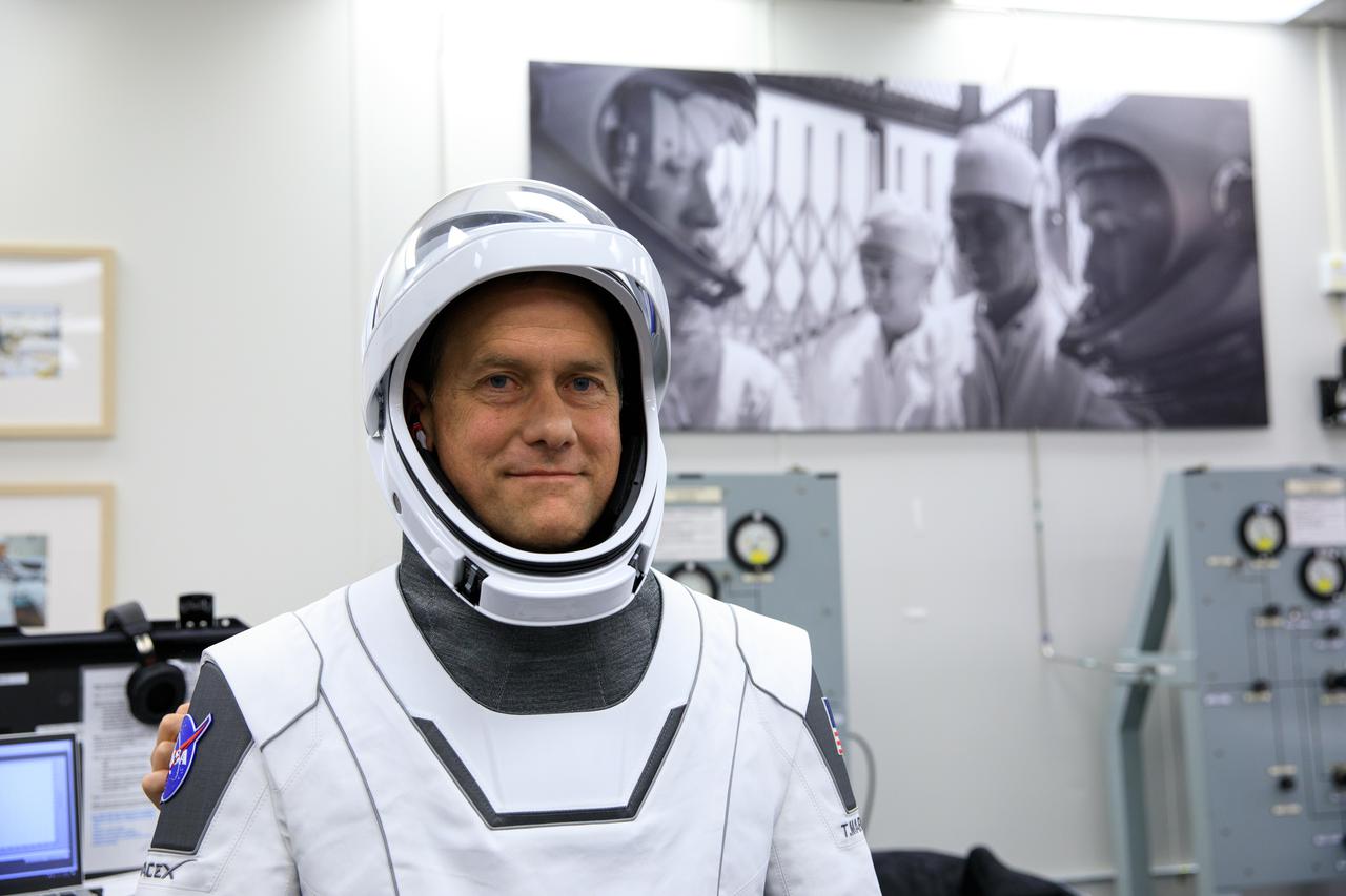NASA SpaceX Crew-3 mission astronaut Thomas Marshburn poses in the suit-up room in the Astronaut Crew Quarters inside Kennedy Space Center’s Neil A. Armstrong Operations and Checkout Building on launch day, Nov. 10, 2021. A team of SpaceX suit technicians assisted the astronauts with their custom-fitted spacesuits, including checking the suits for leaks. The Falcon 9 rocket with Crew Dragon Endurance will launch the four-person crew to the International Space Station for NASA’s Commercial Crew Program. Crew-3 is scheduled to launch at 9:03 p.m. EST from Launch Complex 39A at Kennedy.