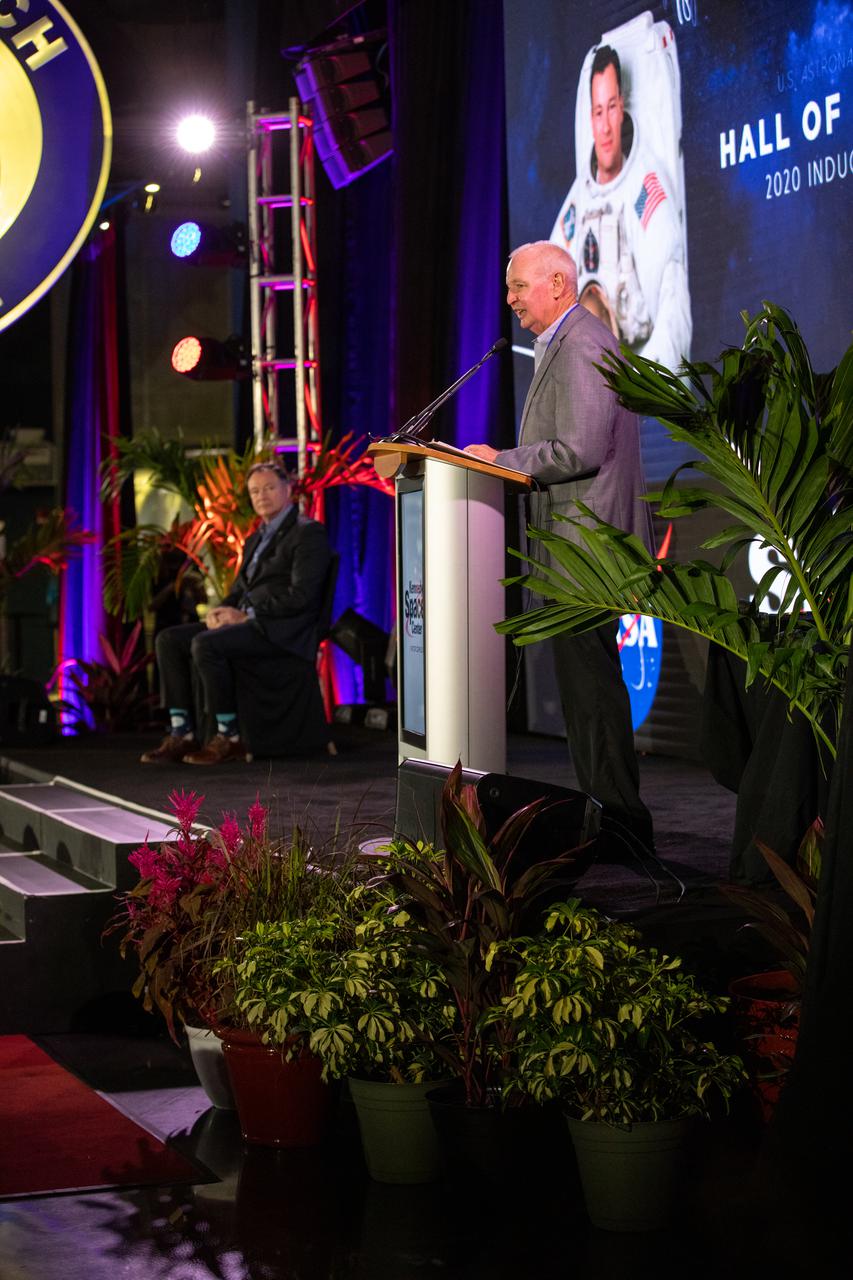 Former NASA astronaut and Hall of Famer Brian Duffy (right) inducts Michael Lopez-Alegria into the U.S. Astronaut Hall of Fame (AHOF) on Nov. 13, 2021, during a ceremony at the Kennedy Space Center Visitor Complex in Florida. Lopez-Alegria received an official medal and became a member of the 19th class of space shuttle astronauts to be inducted. The 2021 inductees were selected by a committee of Hall of Fame astronauts, former NASA officials, flight directors, historians, and journalists. This year’s induction brings the total number of AHOF members to 102.