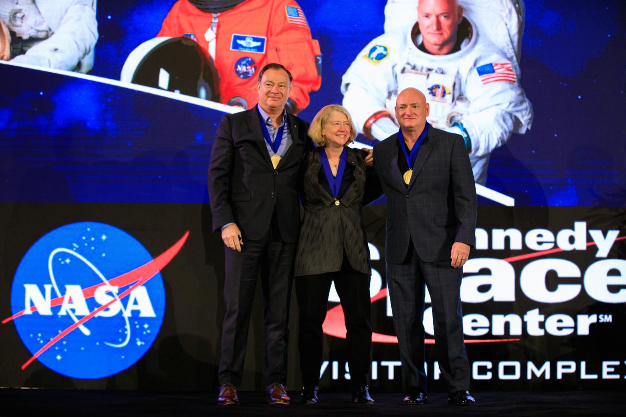 Three veteran astronauts were inducted into the U.S. Astronaut Hall of Fame (AHOF) on Nov. 13, 2021, during a ceremony at the Kennedy Space Center Visitor Complex in Florida. From left are Michael Lopez-Alegria; Pam Melroy, who currently serves as NASA deputy administrator; and Scott Kelly. The three were inducted by former NASA astronaut and Hall of Famer Curt Brown, board chairman of the Astronaut Scholarship Foundation. The inductees each received an official medal and became members of the 19th class of space shuttle astronauts to be inducted. The 2021 inductees were selected by a committee of Hall of Fame astronauts, former NASA officials, flight directors, historians, and journalists. This year’s induction brings the total number of AHOF members to 102. Photo credit: NASA/Kim Shiflett